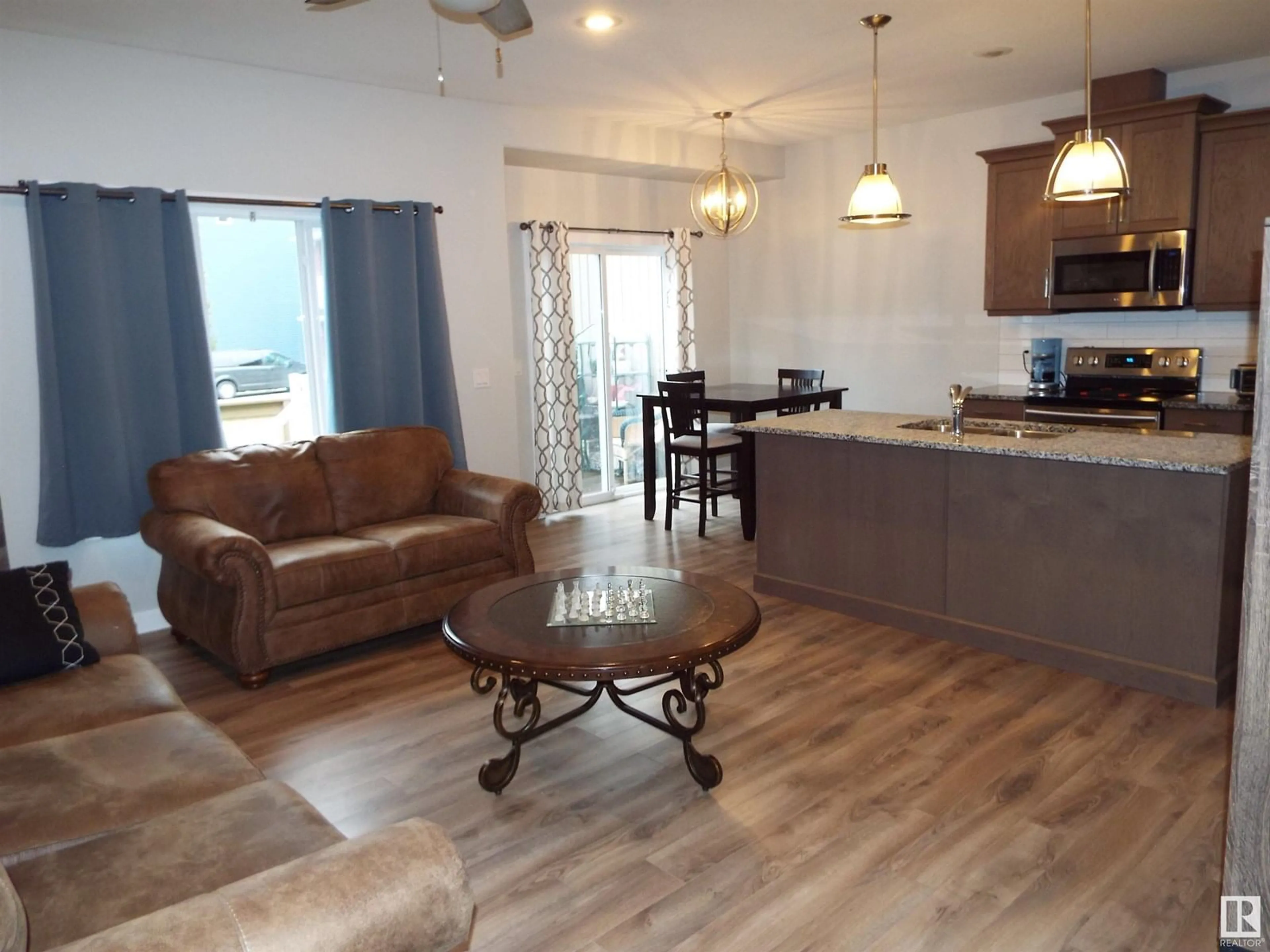 Open concept kitchen, wood/laminate floor for #108 - 300 AWENTIA DR, Leduc Alberta T9E2X2
