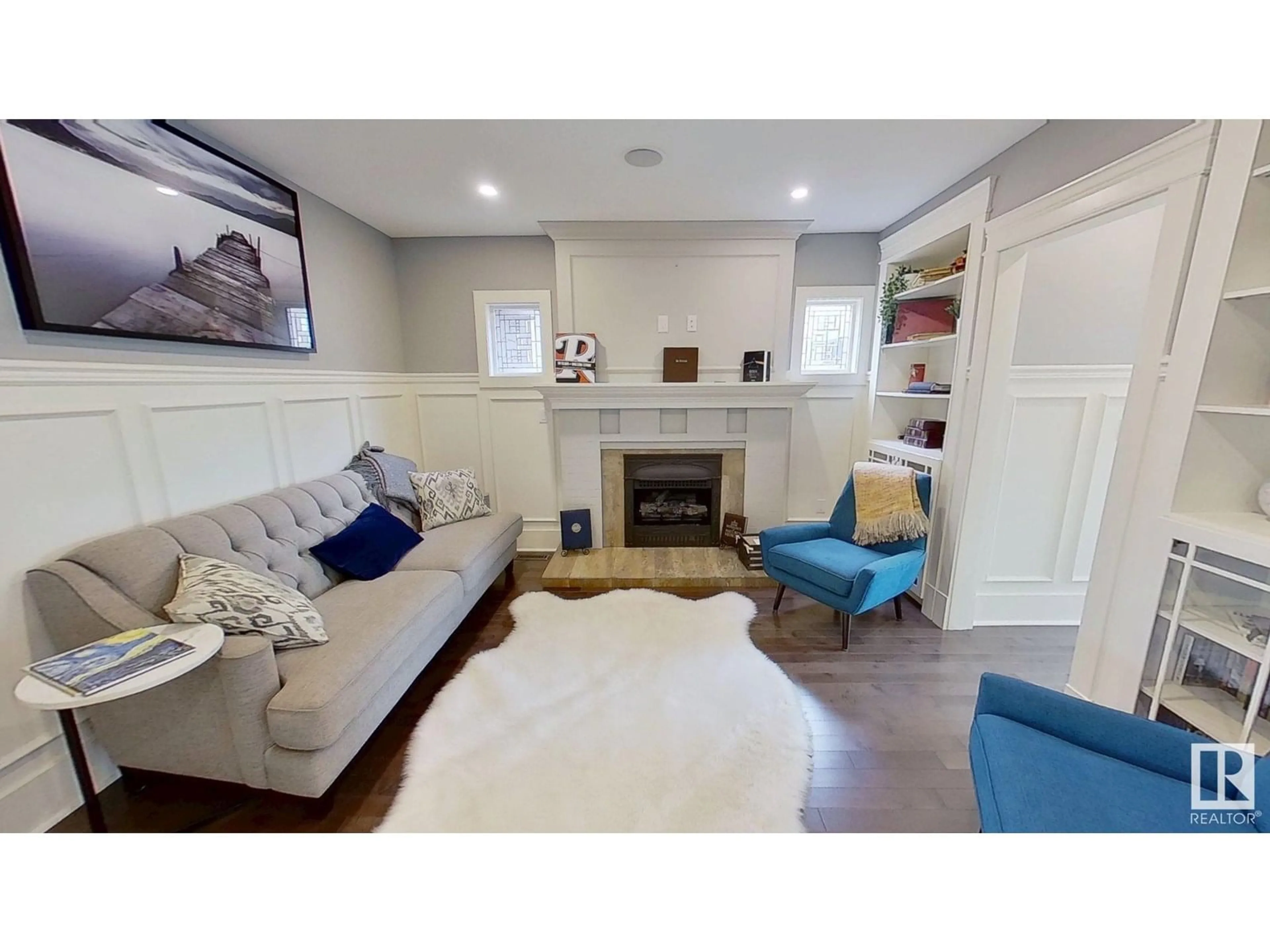 Living room with furniture, wood/laminate floor for 11313 127 ST, Edmonton Alberta T5M0T9
