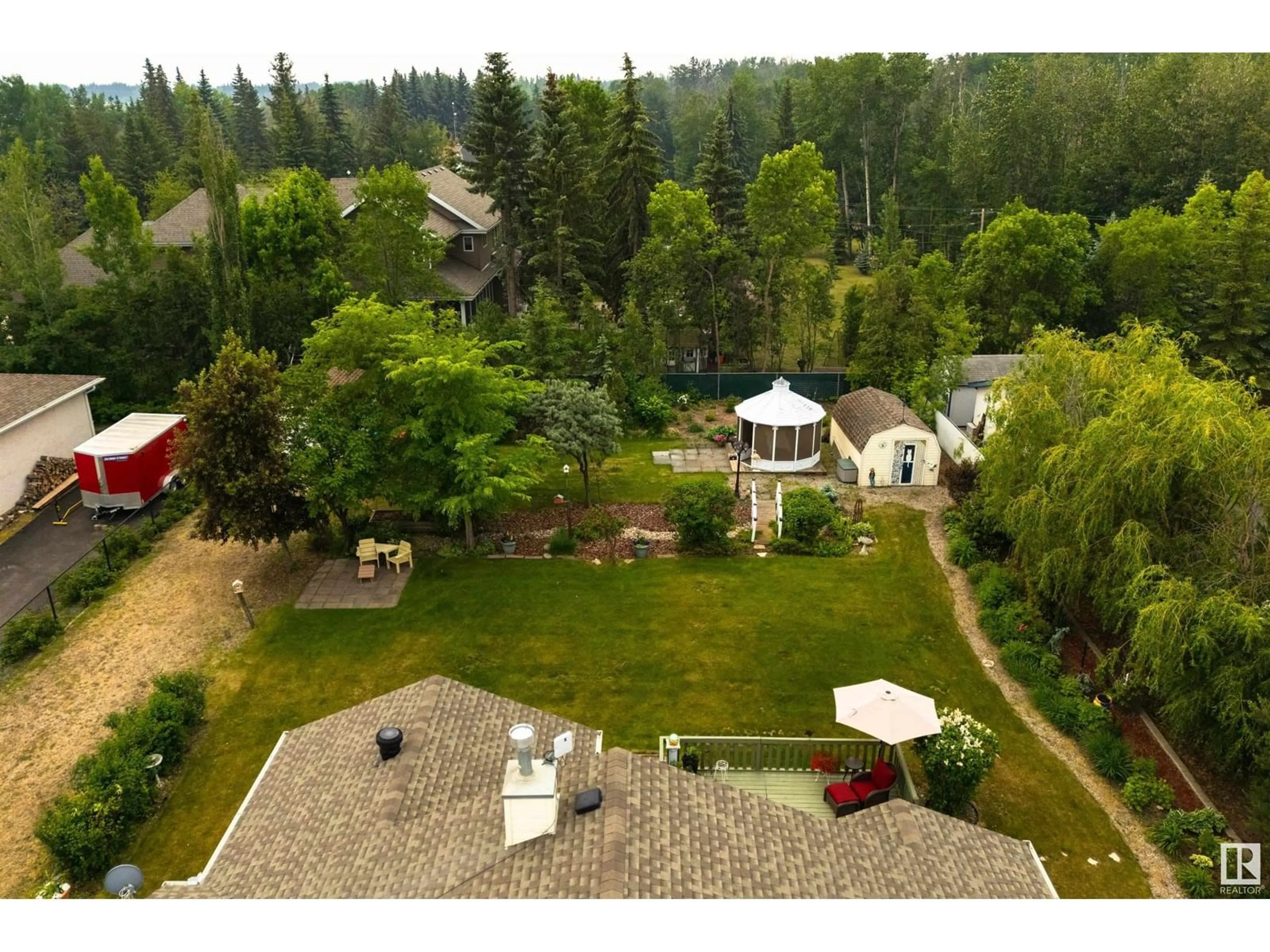 A pic from outside/outdoor area/front of a property/back of a property/a pic from drone, mountain view for 6 - 53302 RGE ROAD 261, Rural Parkland County Alberta T7Y1A7