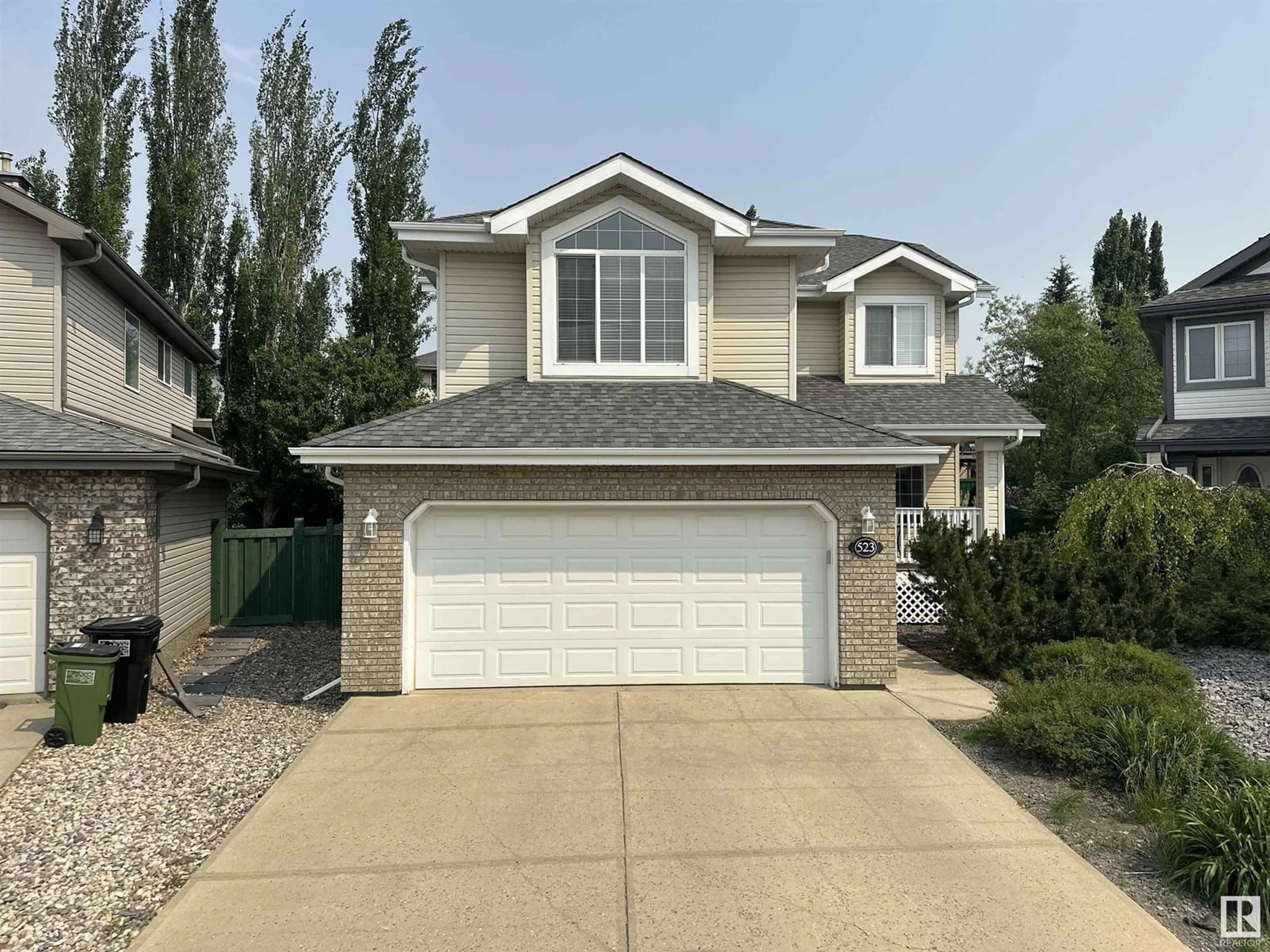 Home with vinyl exterior material, street for 523 HUNTERS GR, Edmonton Alberta T6R3B6