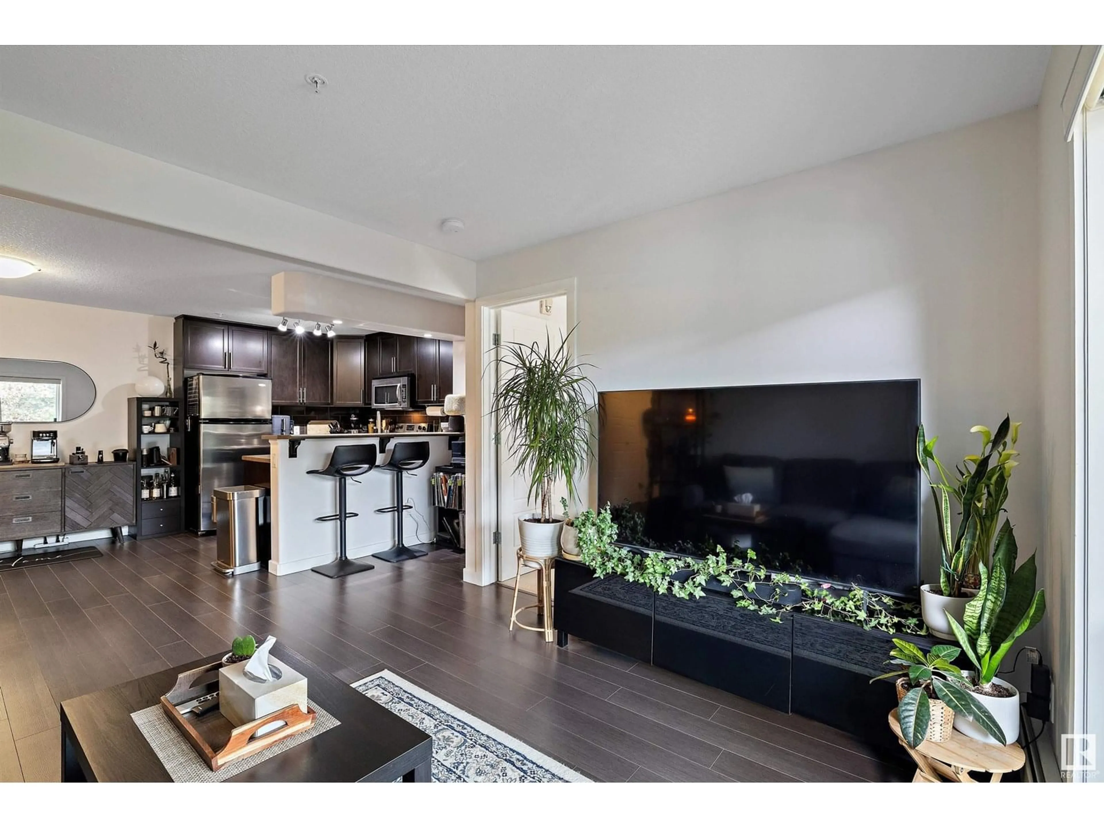 Open concept kitchen, wood/laminate floor for 251 - 11517 ELLERSLIE RD, Edmonton Alberta T6W2A9