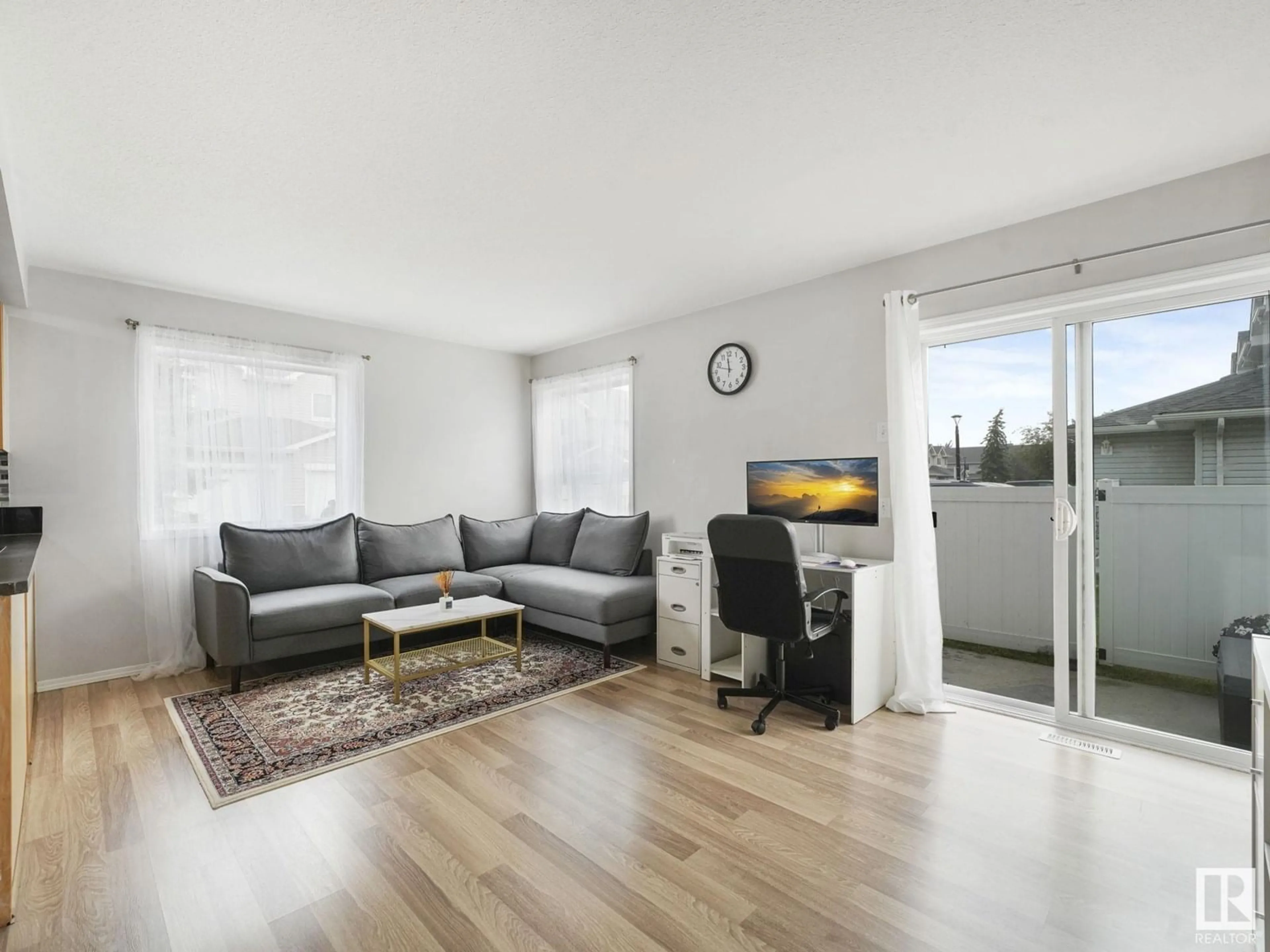 Living room with furniture, wood/laminate floor for 230 - 183 EDWARDS DR, Edmonton Alberta T6X1G7