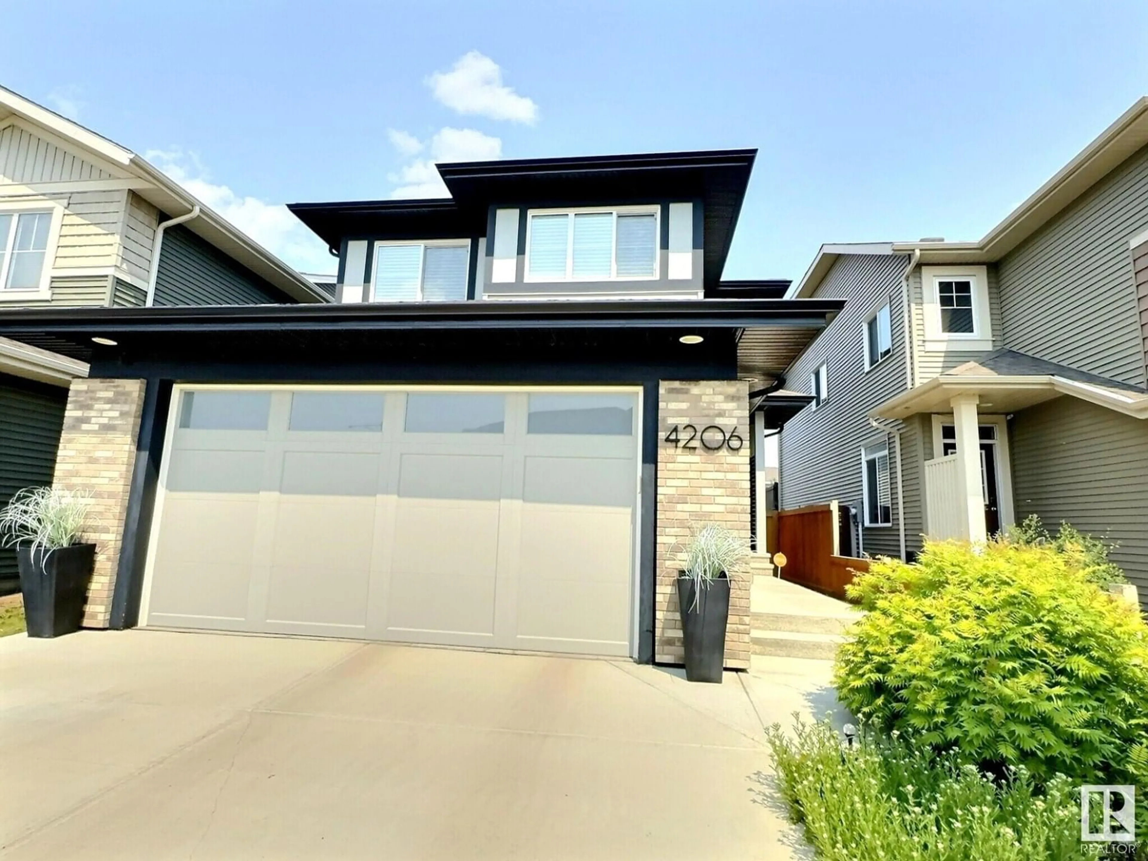 Home with vinyl exterior material, street for 4206 CHICHAK CL, Edmonton Alberta T6W4B3