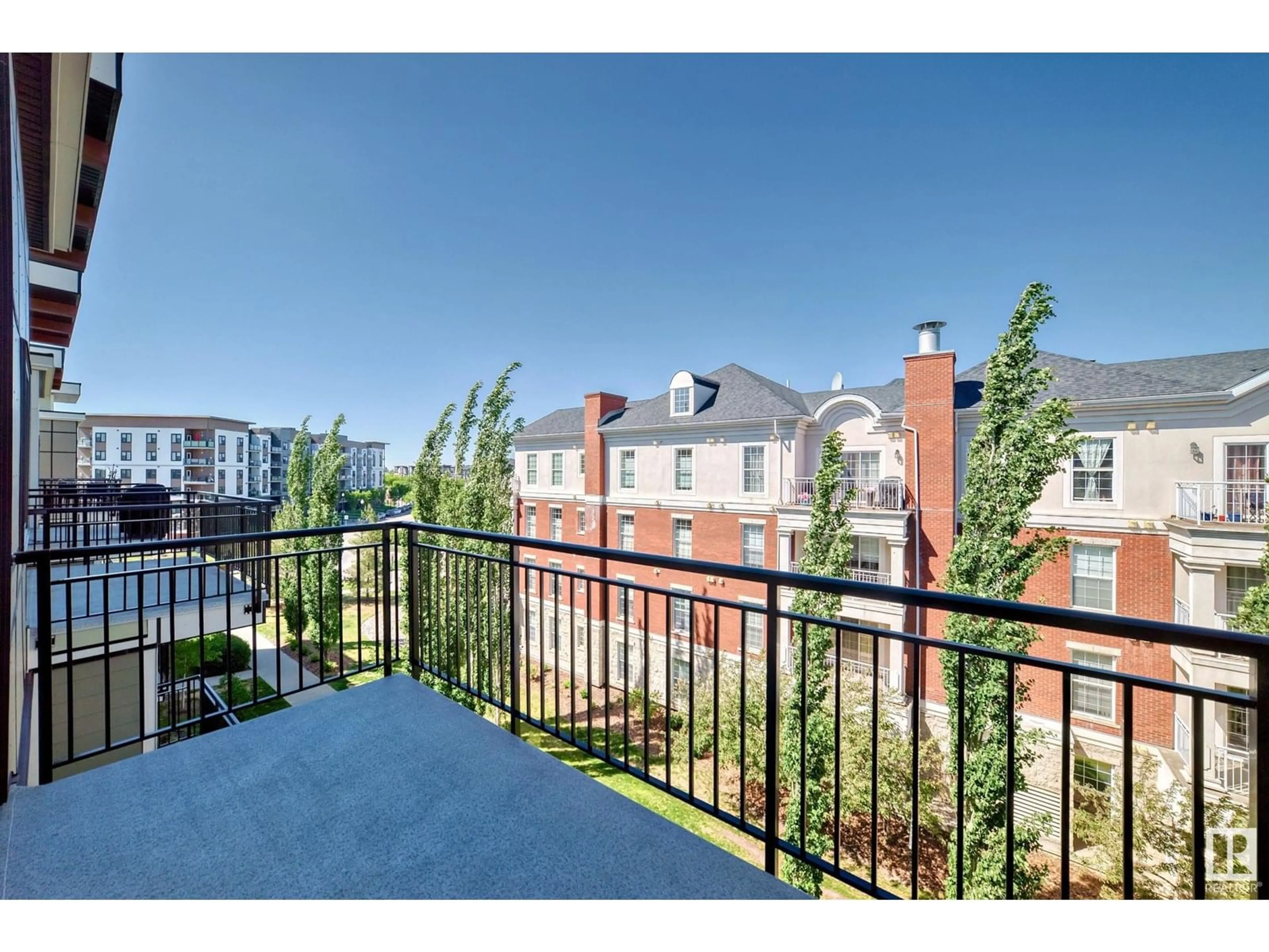 Patio, city buildings view from balcony for #414 - 560 GRIESBACH PARADE PR, Edmonton Alberta T5E6X1