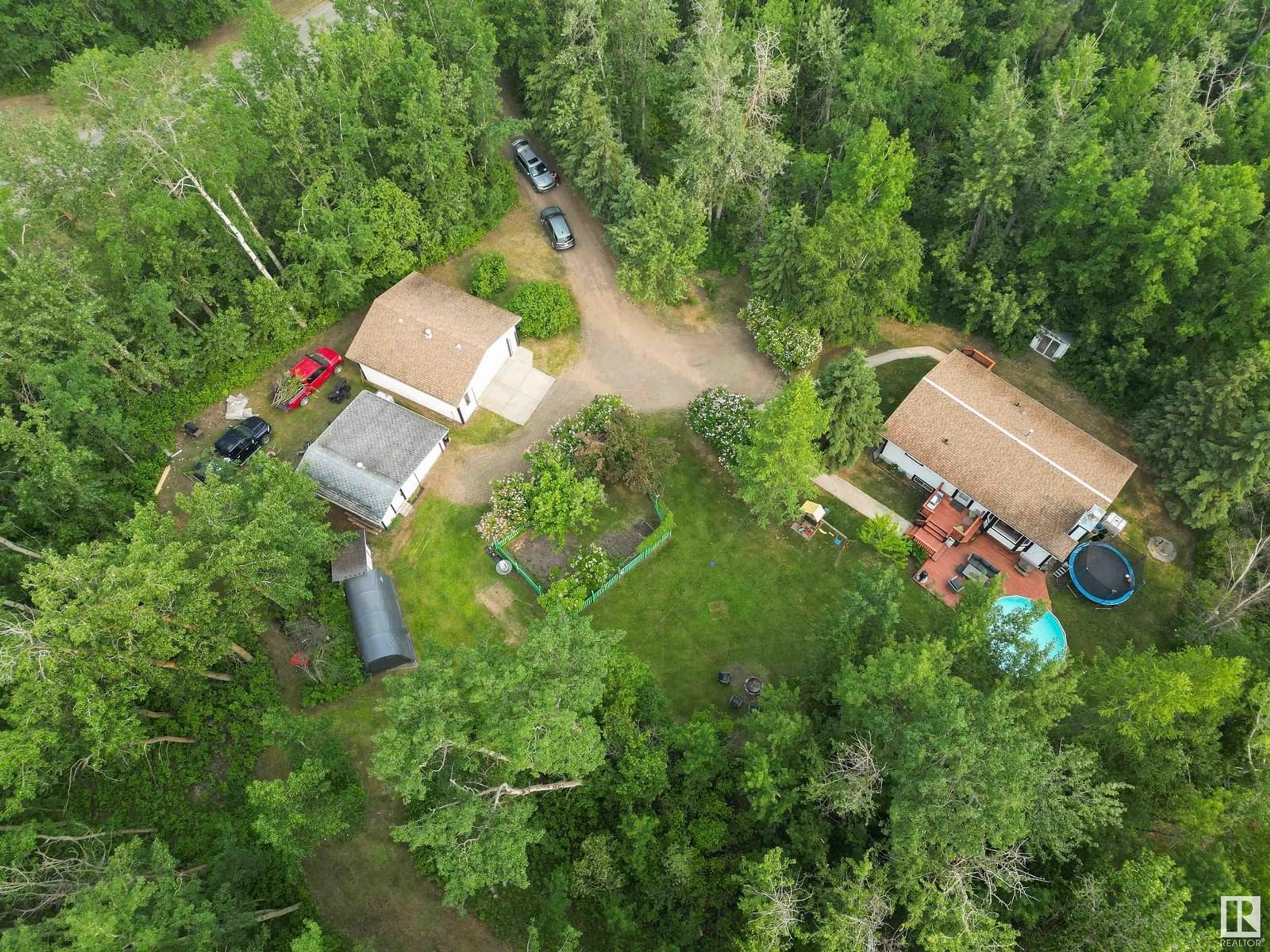 A pic from outside/outdoor area/front of a property/back of a property/a pic from drone, forest/trees view for 121 53347 RGE ROAD 215, Rural Strathcona County Alberta T8E2B2