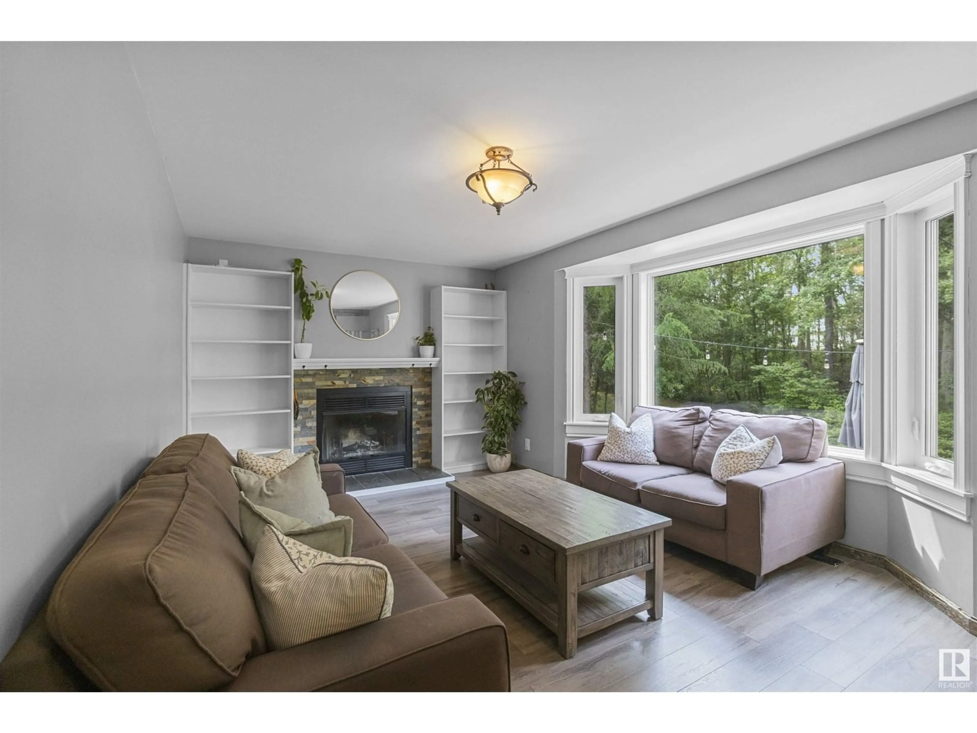Living room with furniture, wood/laminate floor for 121 53347 RGE ROAD 215, Rural Strathcona County Alberta T8E2B2