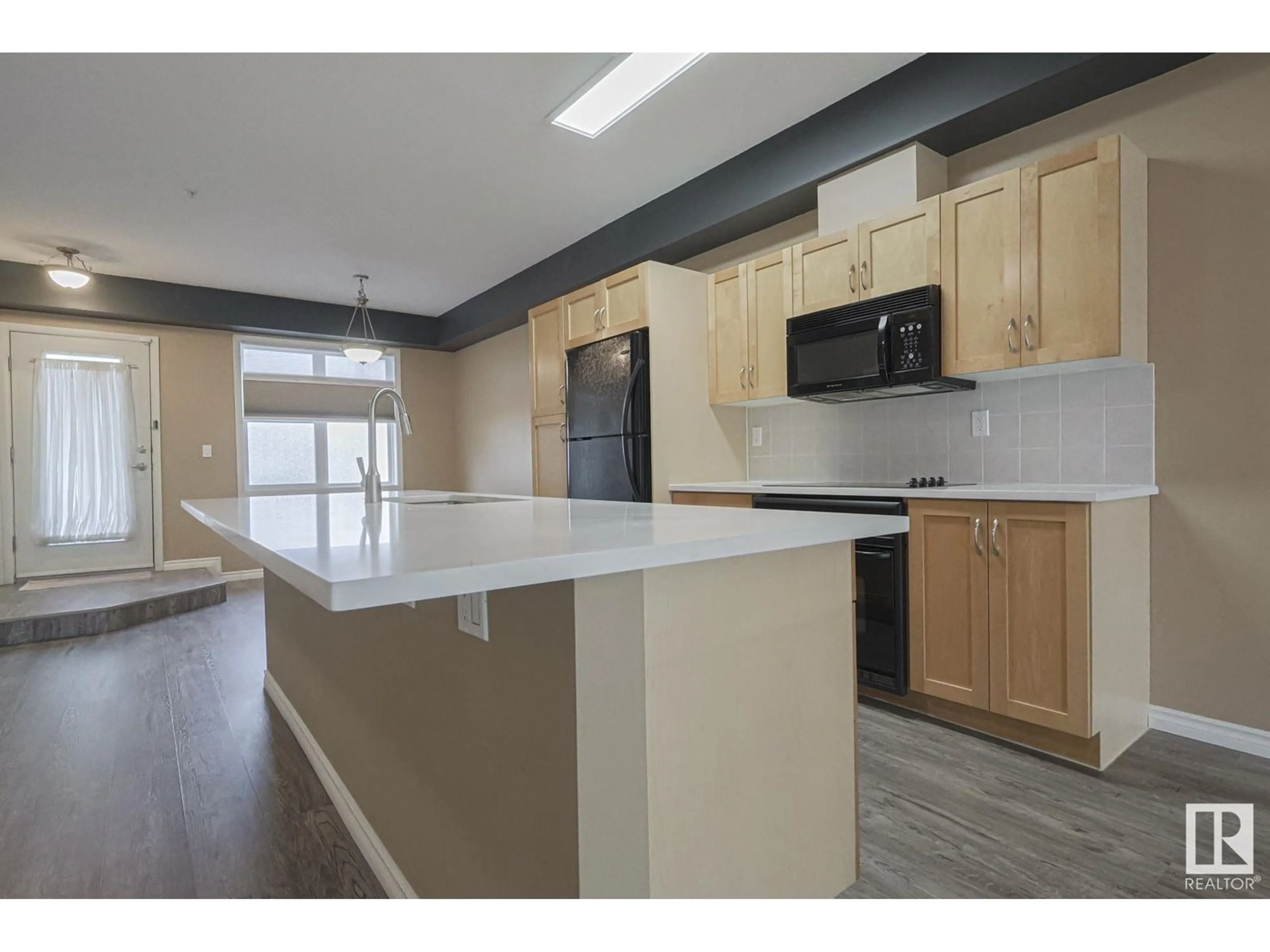 Open concept kitchen, unknown for #113 - 9507 101 AV NW, Edmonton Alberta T5H4R1