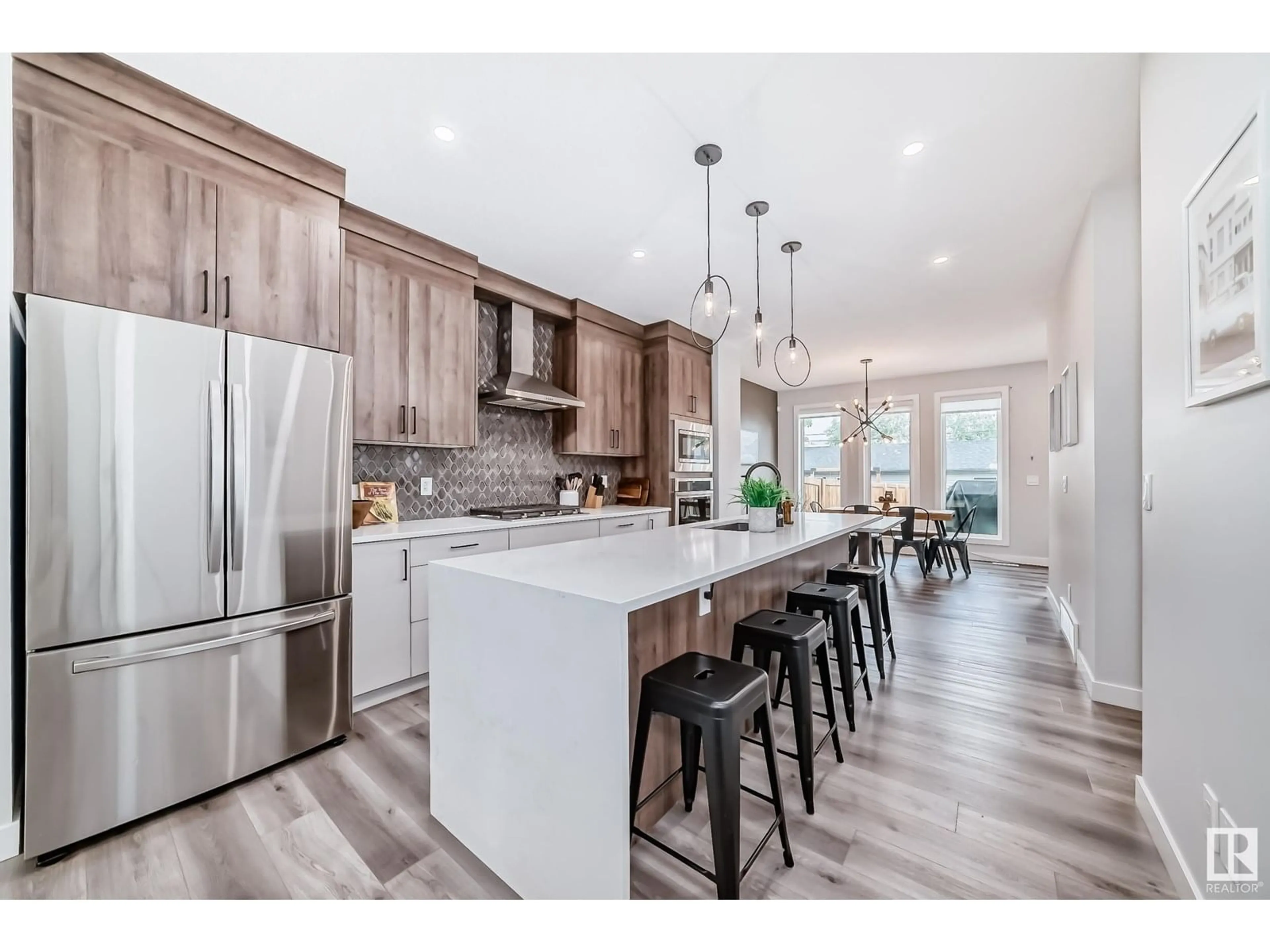 Open concept kitchen, wood/laminate floor for NW - 11551 122 ST, Edmonton Alberta T5M0B6