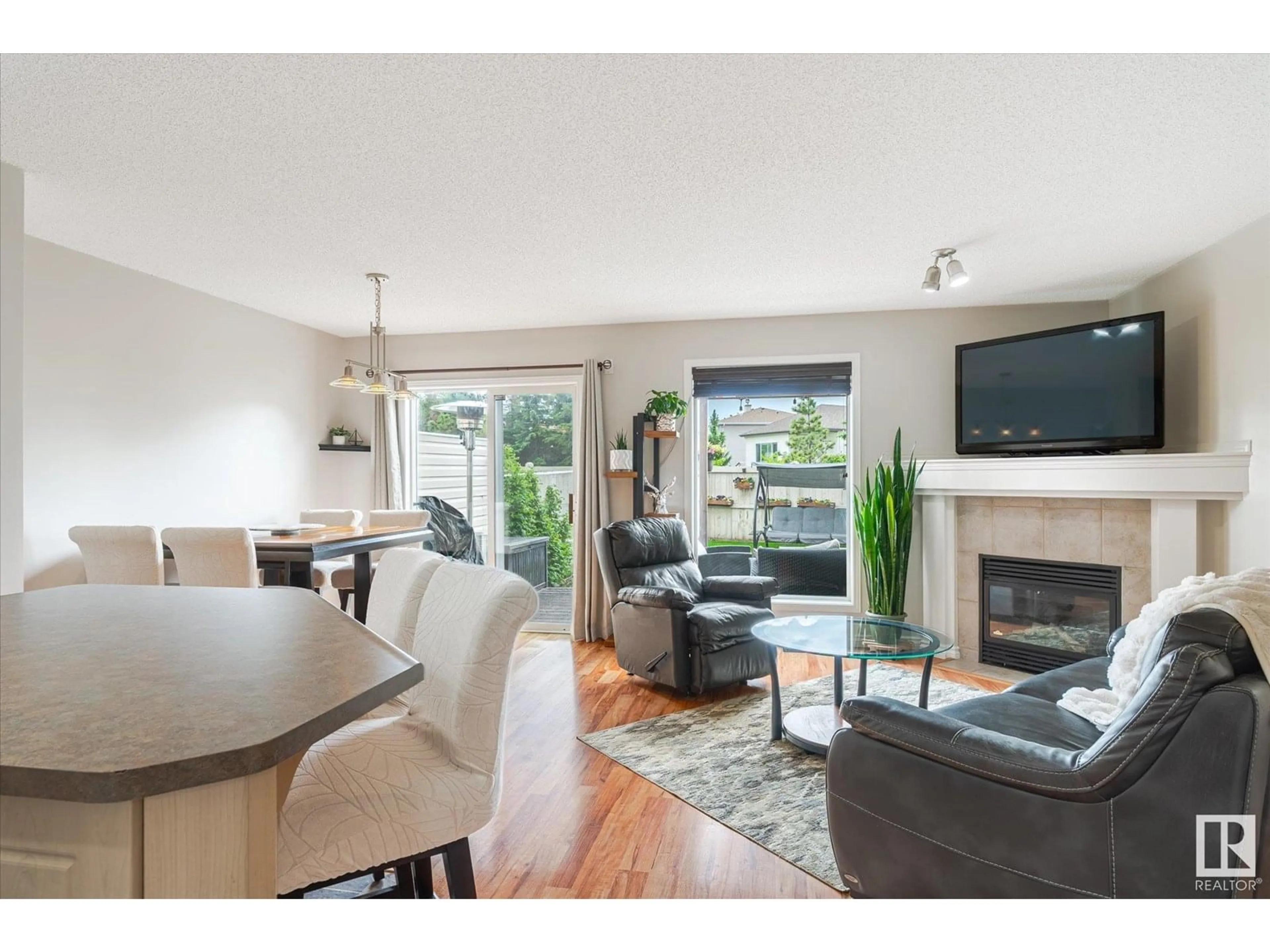 Living room with furniture, wood/laminate floor for 6831 159A AV, Edmonton Alberta T5Z3N9