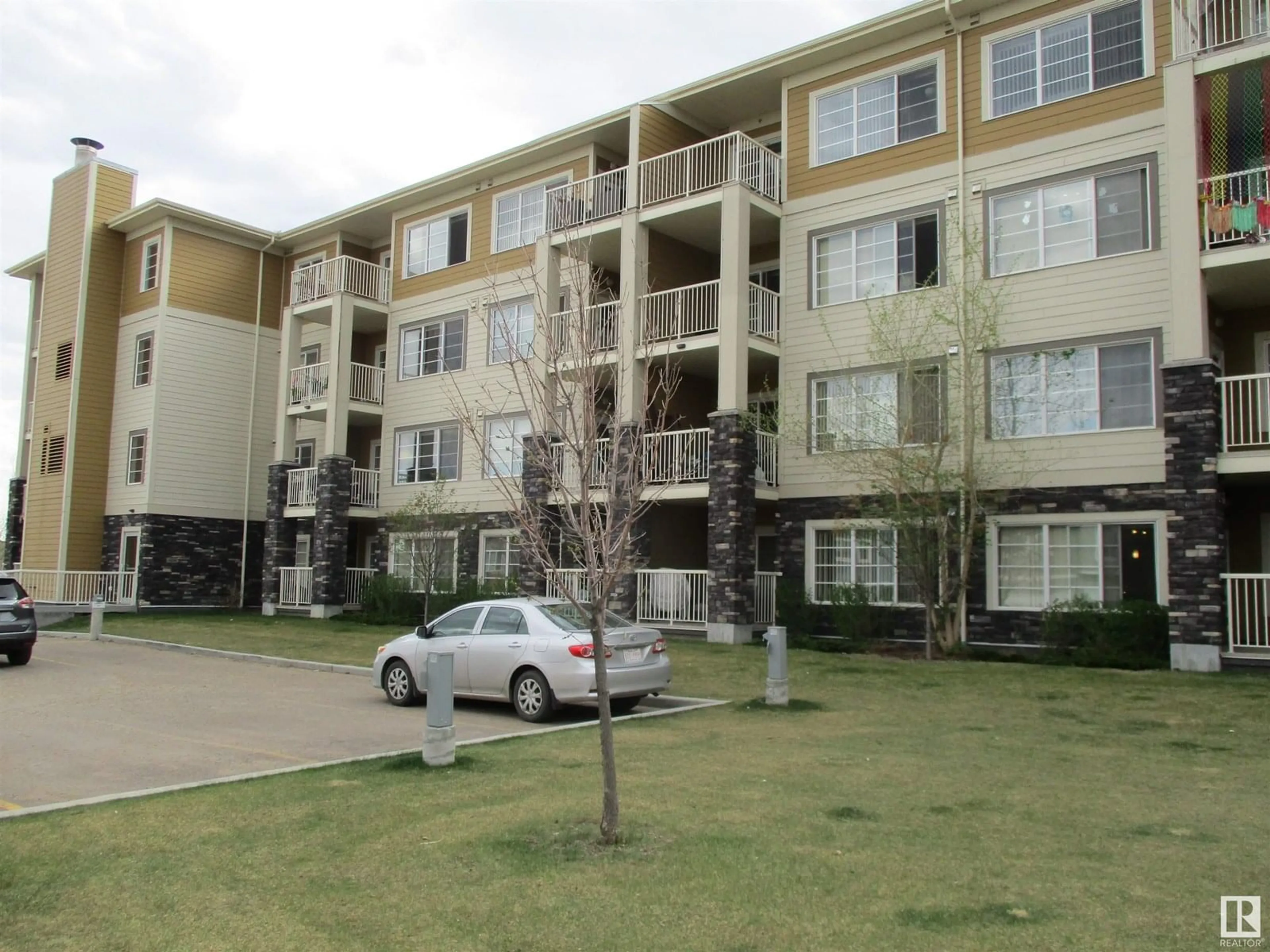 A pic from outside/outdoor area/front of a property/back of a property/a pic from drone, building for #221 - 3670 139 AV NW, Edmonton Alberta T5Y3N5