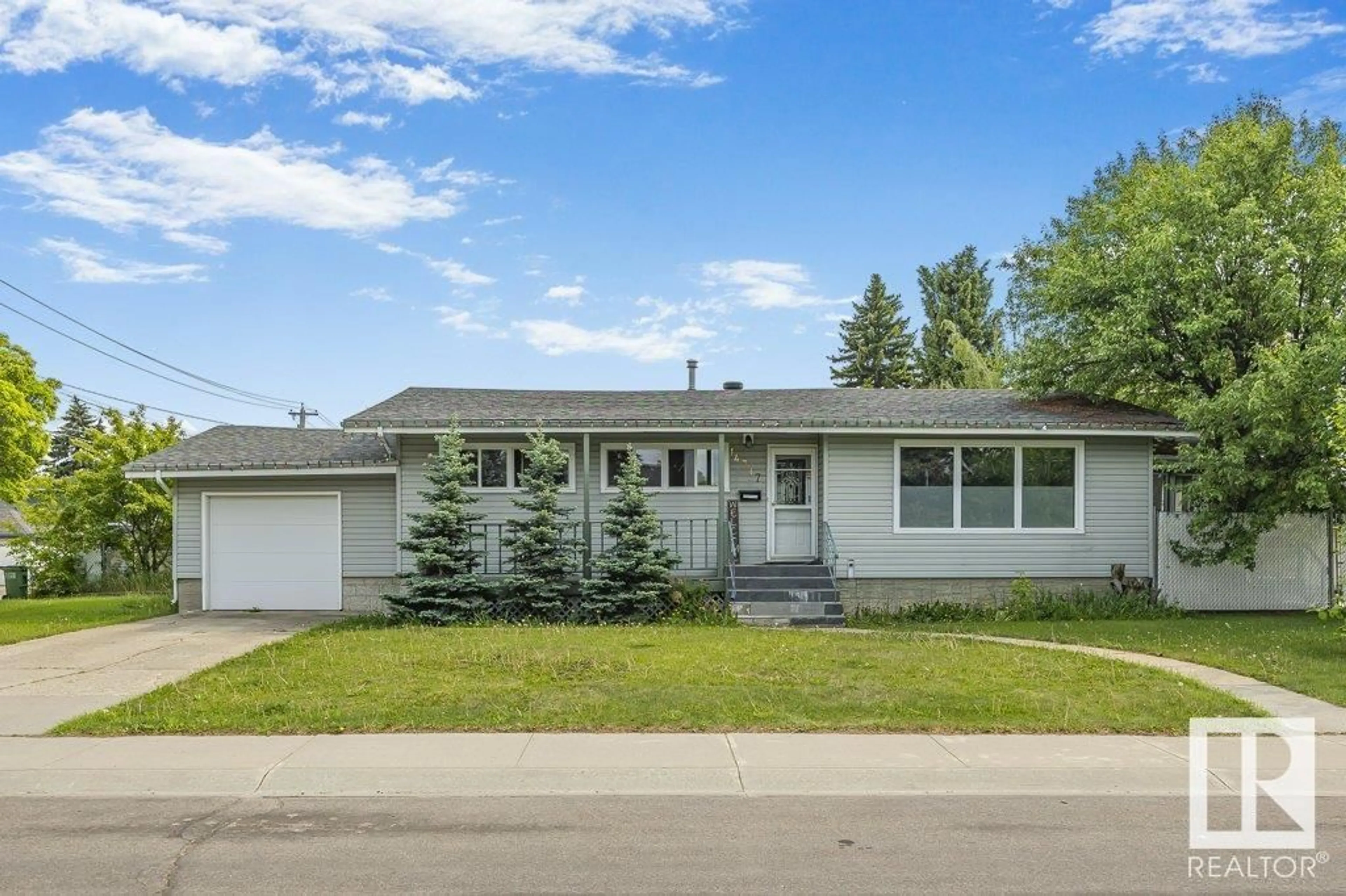 Home with vinyl exterior material, street for NW - 14317 90A AV, Edmonton Alberta T5R4X7