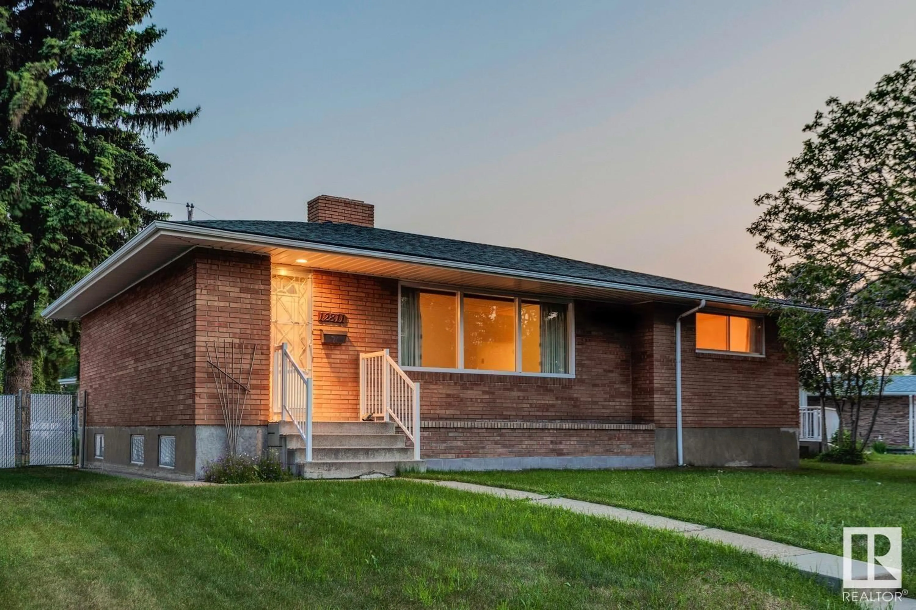 Home with brick exterior material, street for NW - 12811 137 AV, Edmonton Alberta T5L4C3