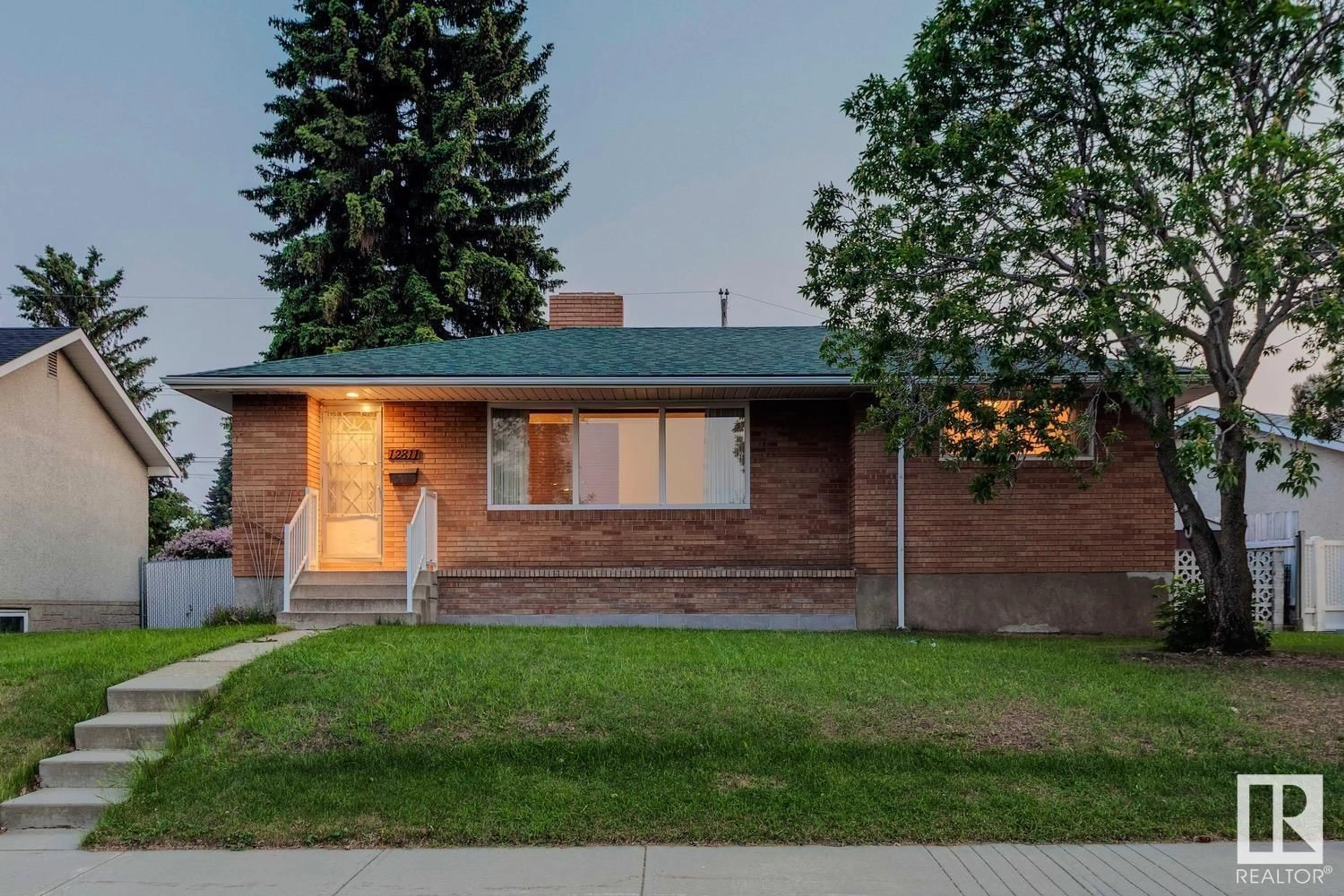 Home with brick exterior material, street for NW - 12811 137 AV, Edmonton Alberta T5L4C3