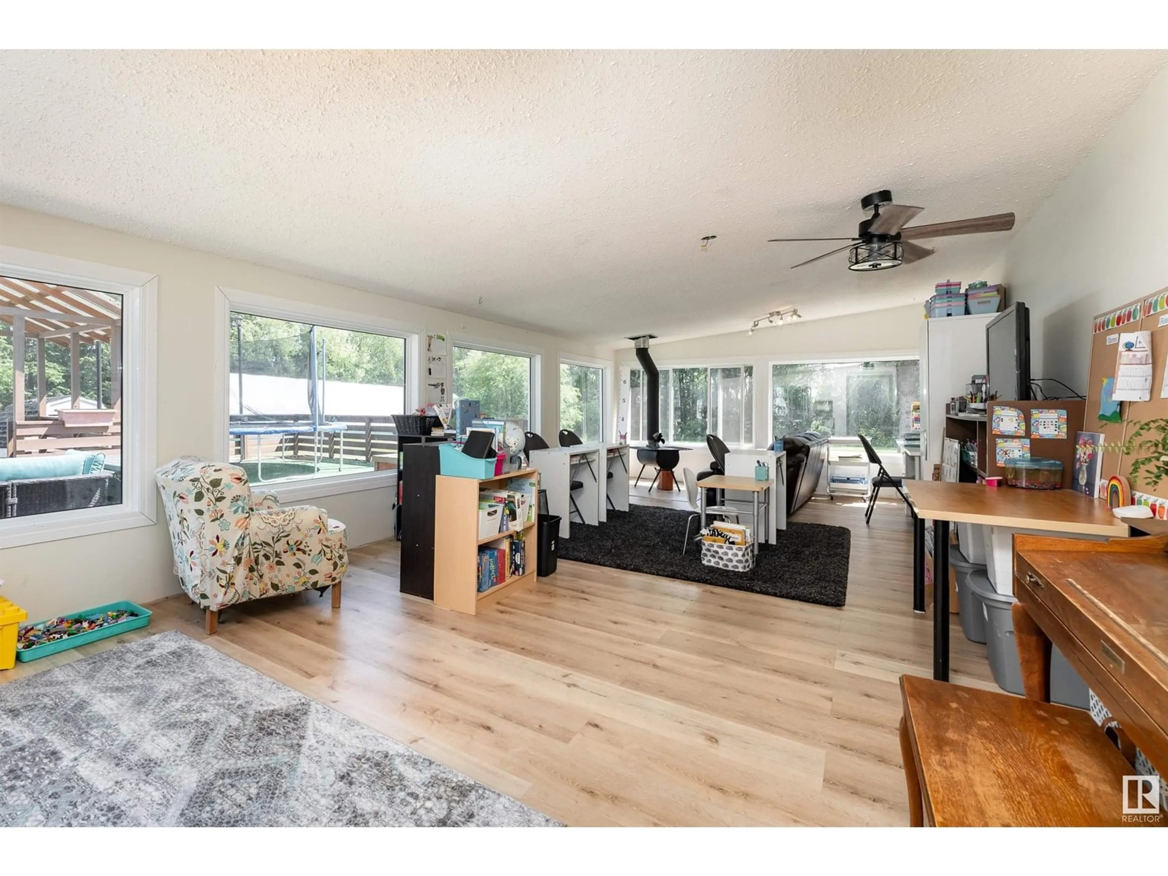 Living room with furniture, wood/laminate floor for 50437 RGE ROAD 235, Rural Leduc County Alberta T4X0M2