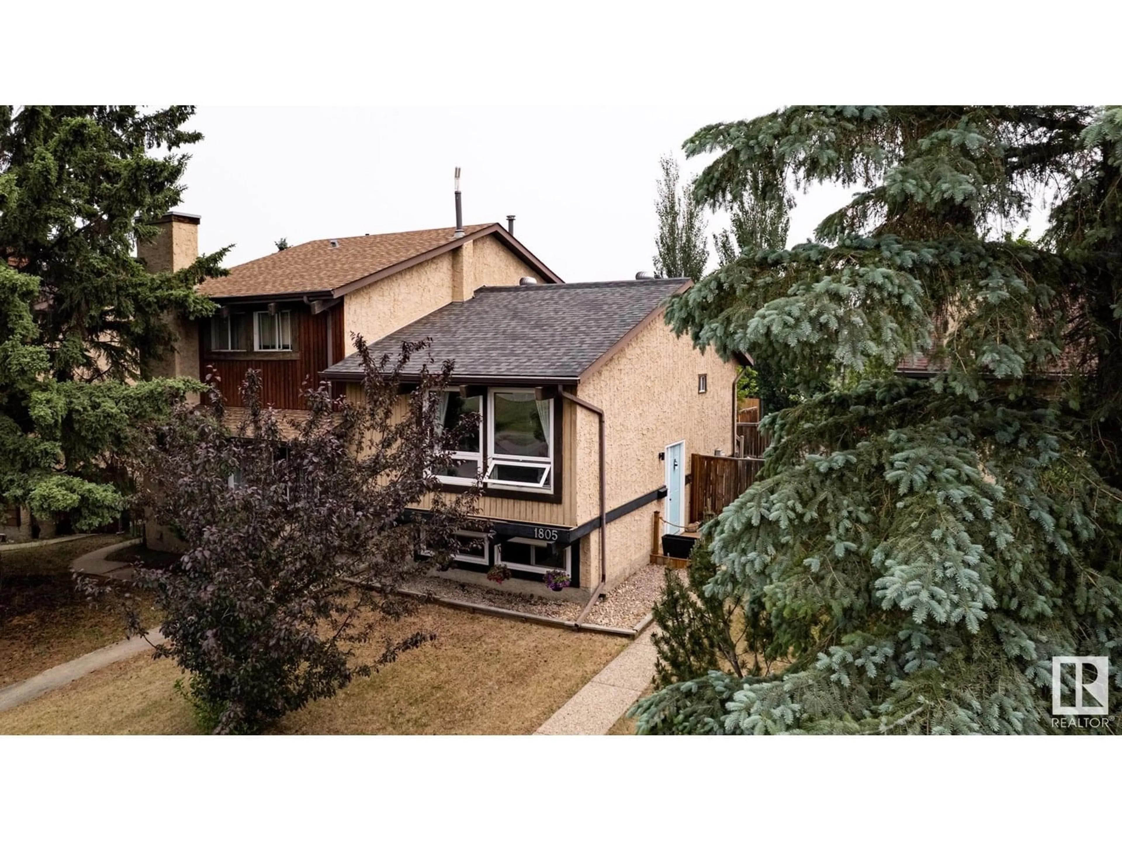 A pic from outside/outdoor area/front of a property/back of a property/a pic from drone, street for 1805 105 ST, Edmonton Alberta T6J5M4
