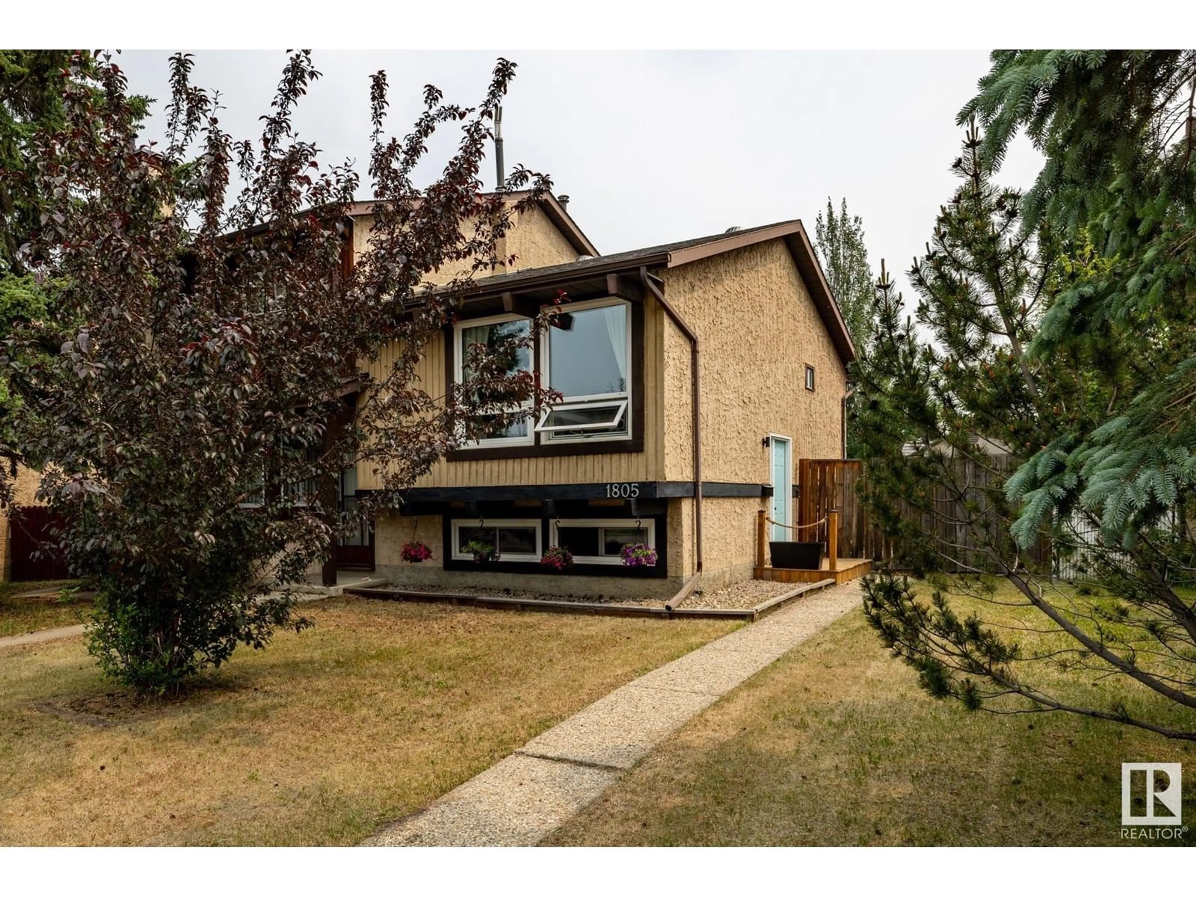 Home with vinyl exterior material, street for 1805 105 ST, Edmonton Alberta T6J5M4