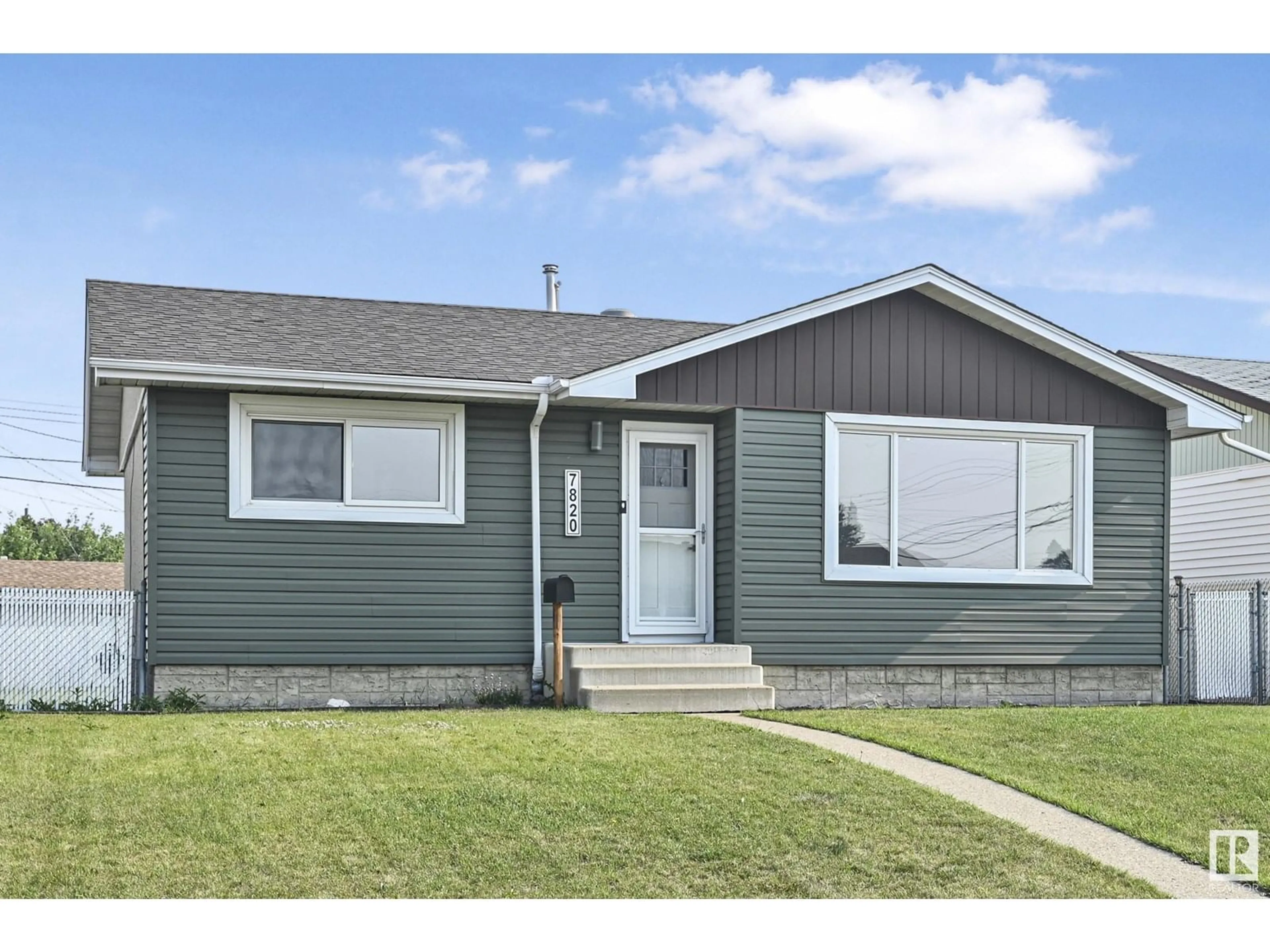 Home with vinyl exterior material, street for 7820 130 AV, Edmonton Alberta T5C1V5