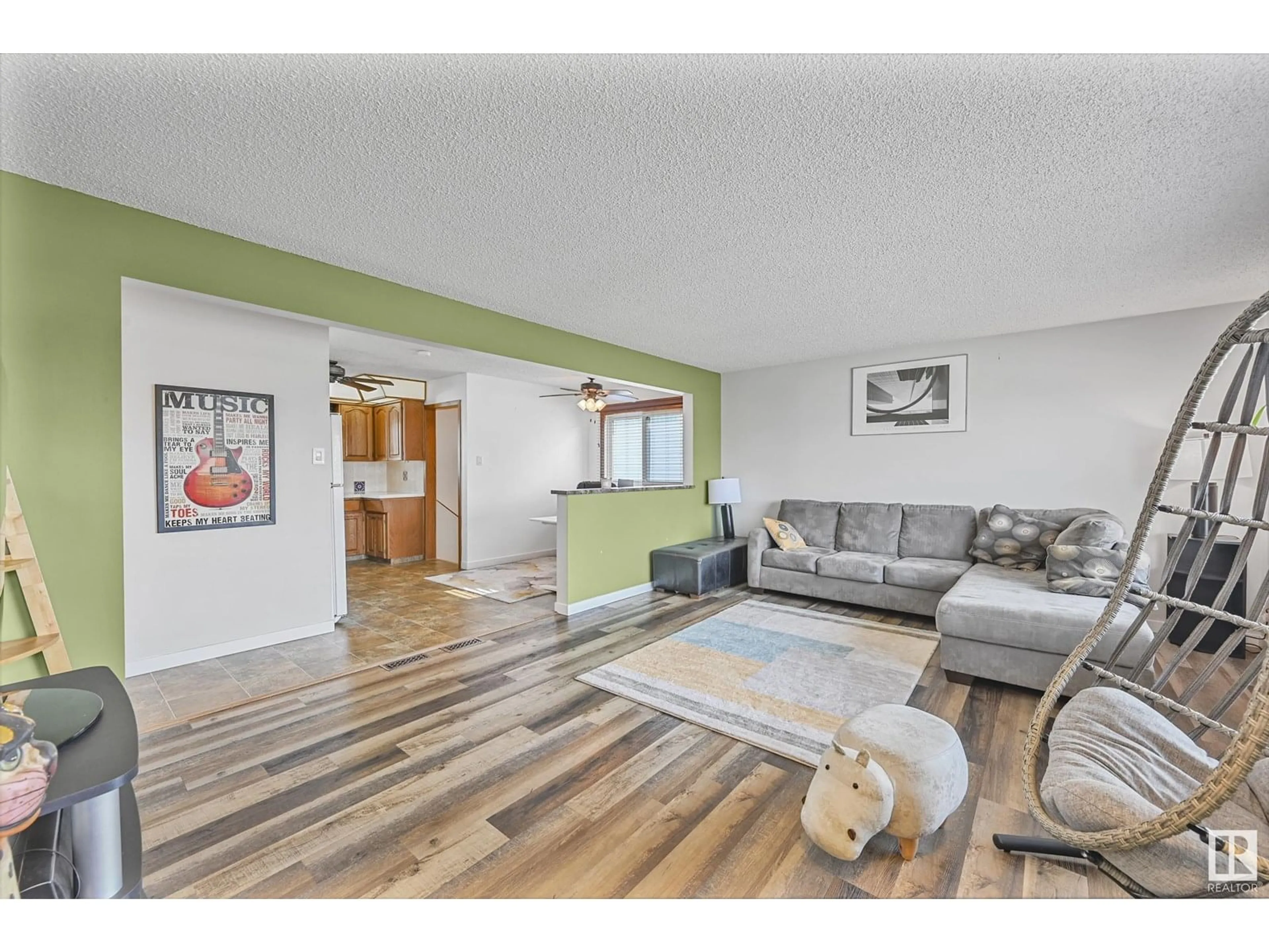 Living room with furniture, wood/laminate floor for 7820 130 AV, Edmonton Alberta T5C1V5