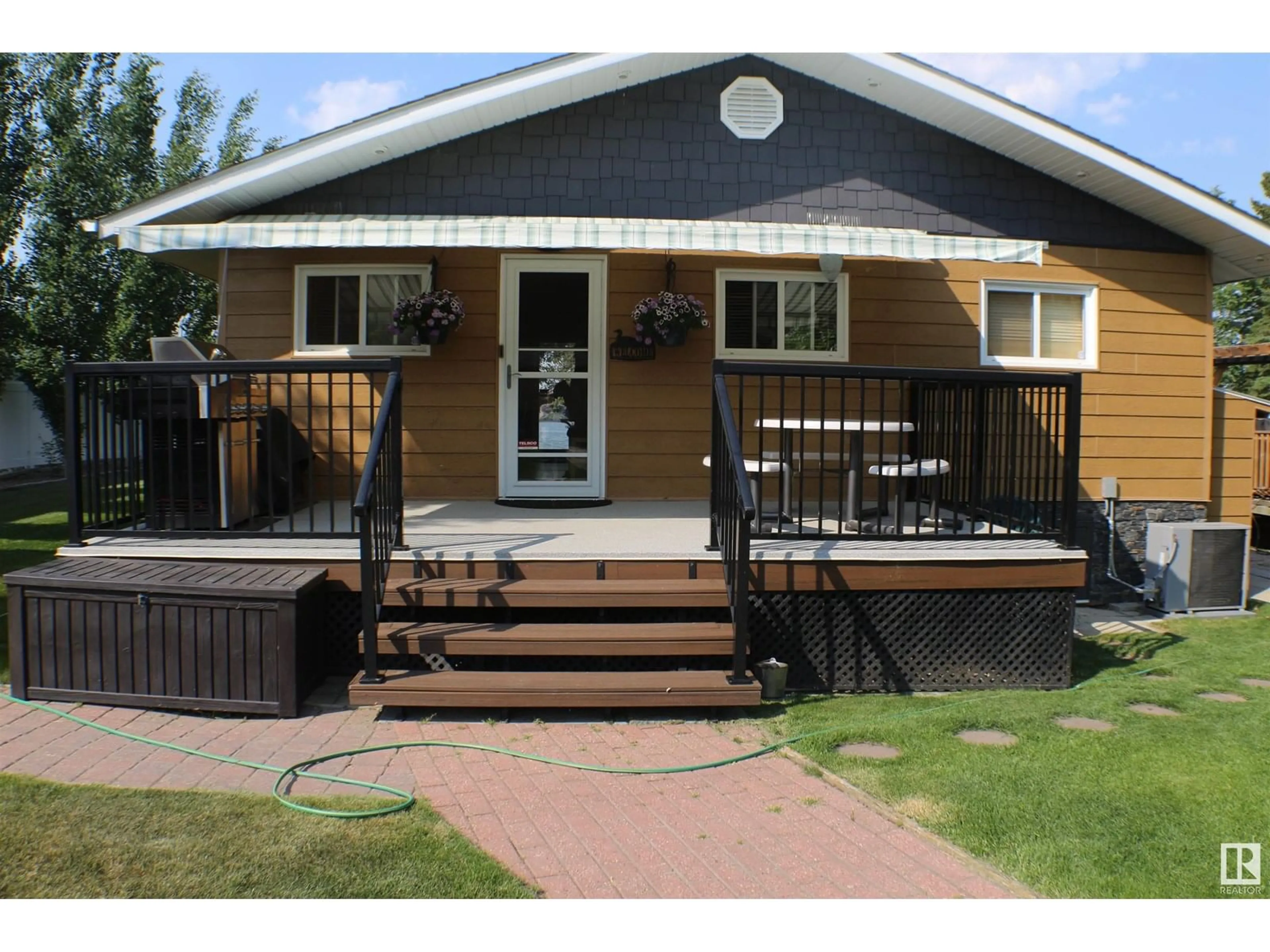 Home with vinyl exterior material, street for 5582 NAKAMUN DR, Rural Lac Ste. Anne County Alberta T0E1V0