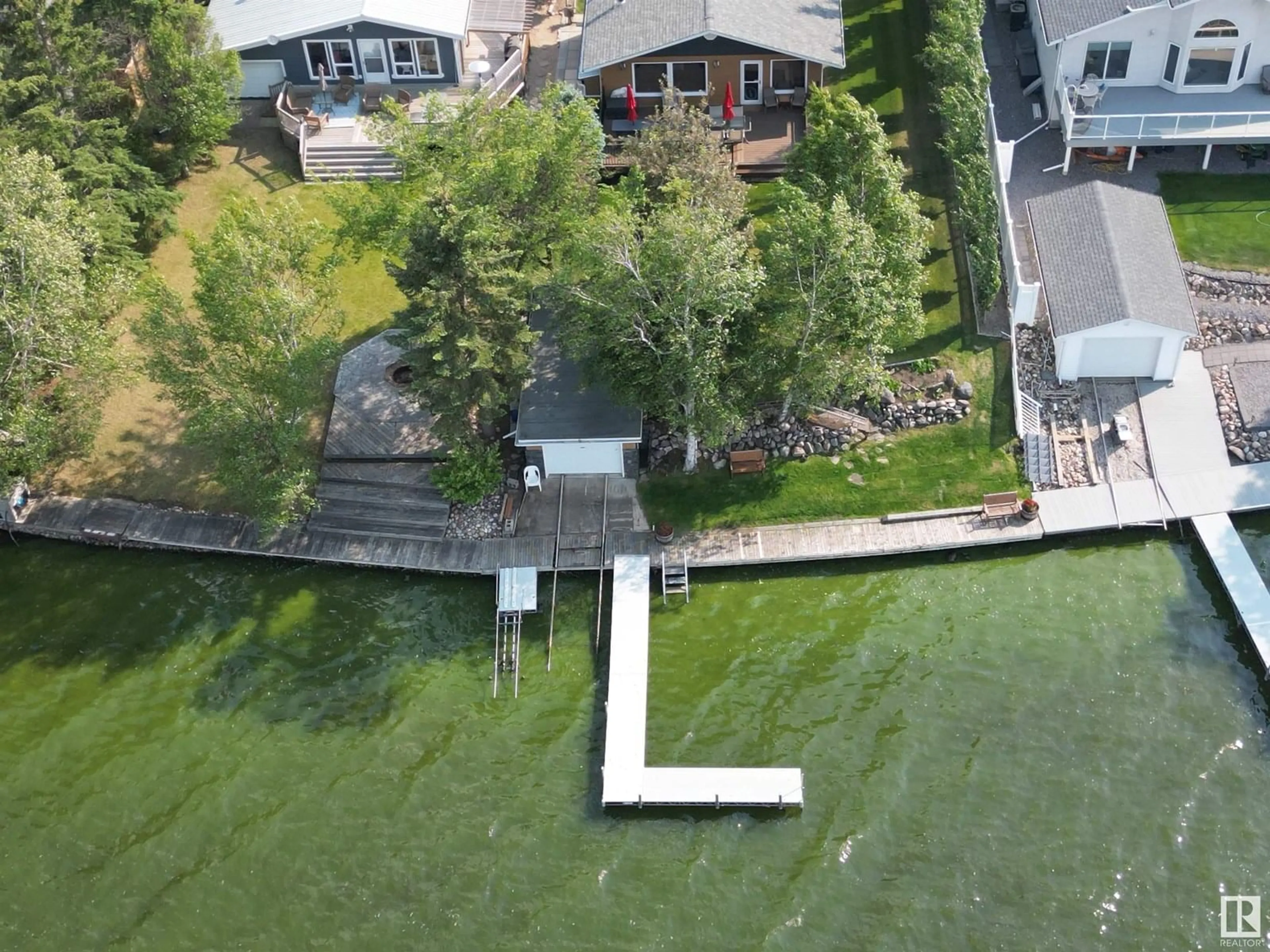 A pic from outside/outdoor area/front of a property/back of a property/a pic from drone, water/lake/river/ocean view for 5582 NAKAMUN DR, Rural Lac Ste. Anne County Alberta T0E1V0