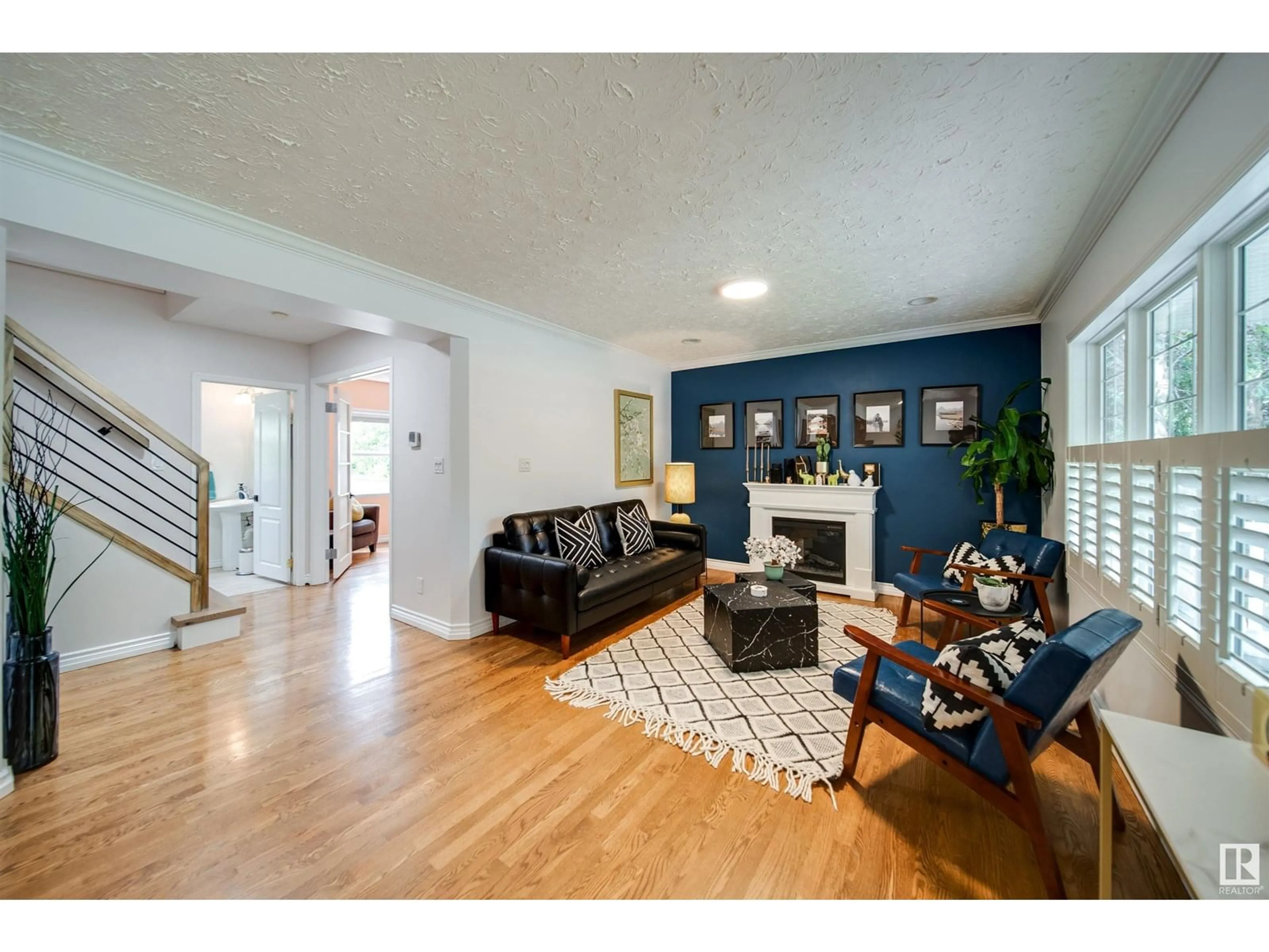 Living room with furniture, wood/laminate floor for NW - 14015 104A AV, Edmonton Alberta T5N0Y1