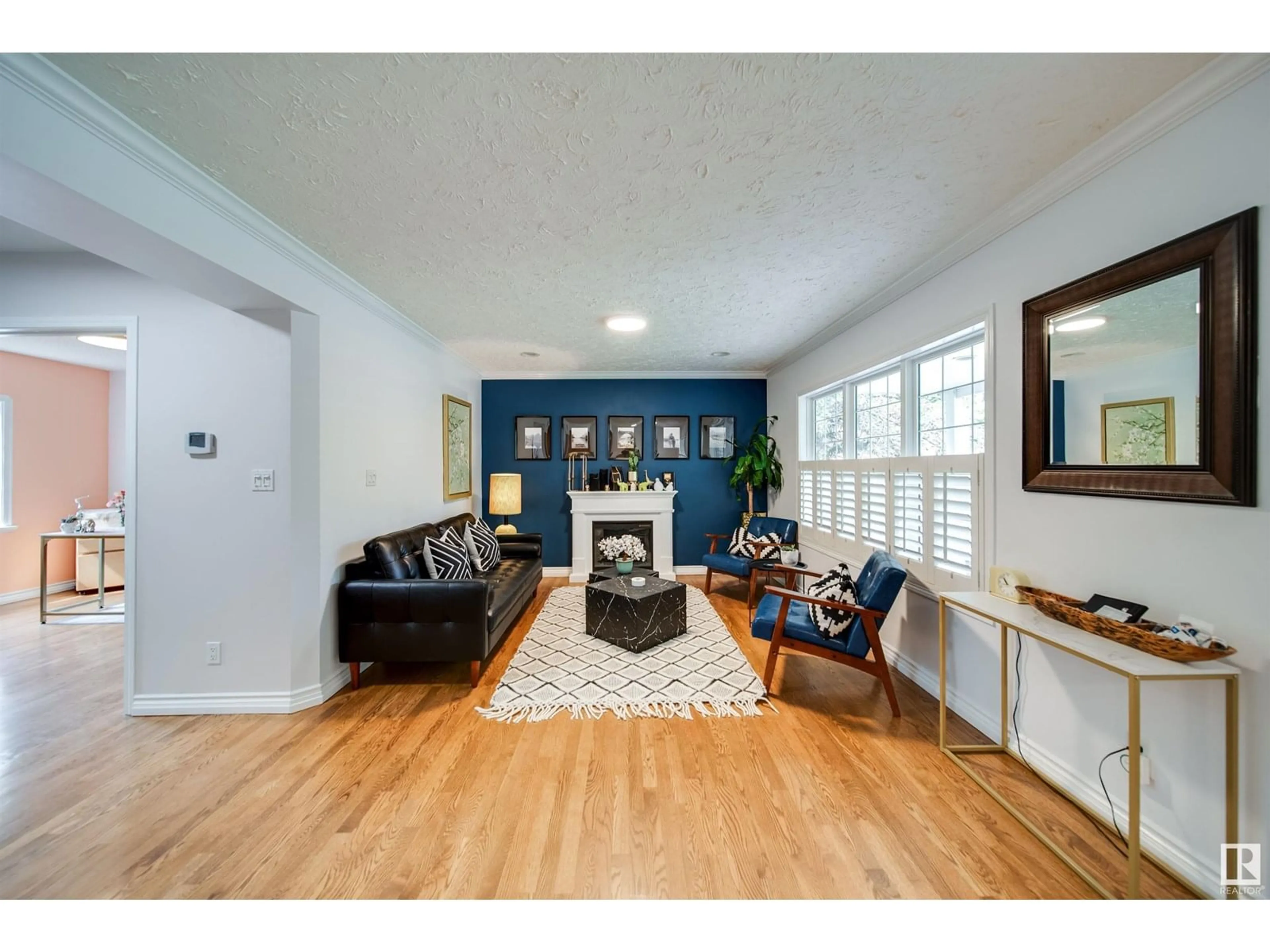 Living room with furniture, wood/laminate floor for NW - 14015 104A AV, Edmonton Alberta T5N0Y1