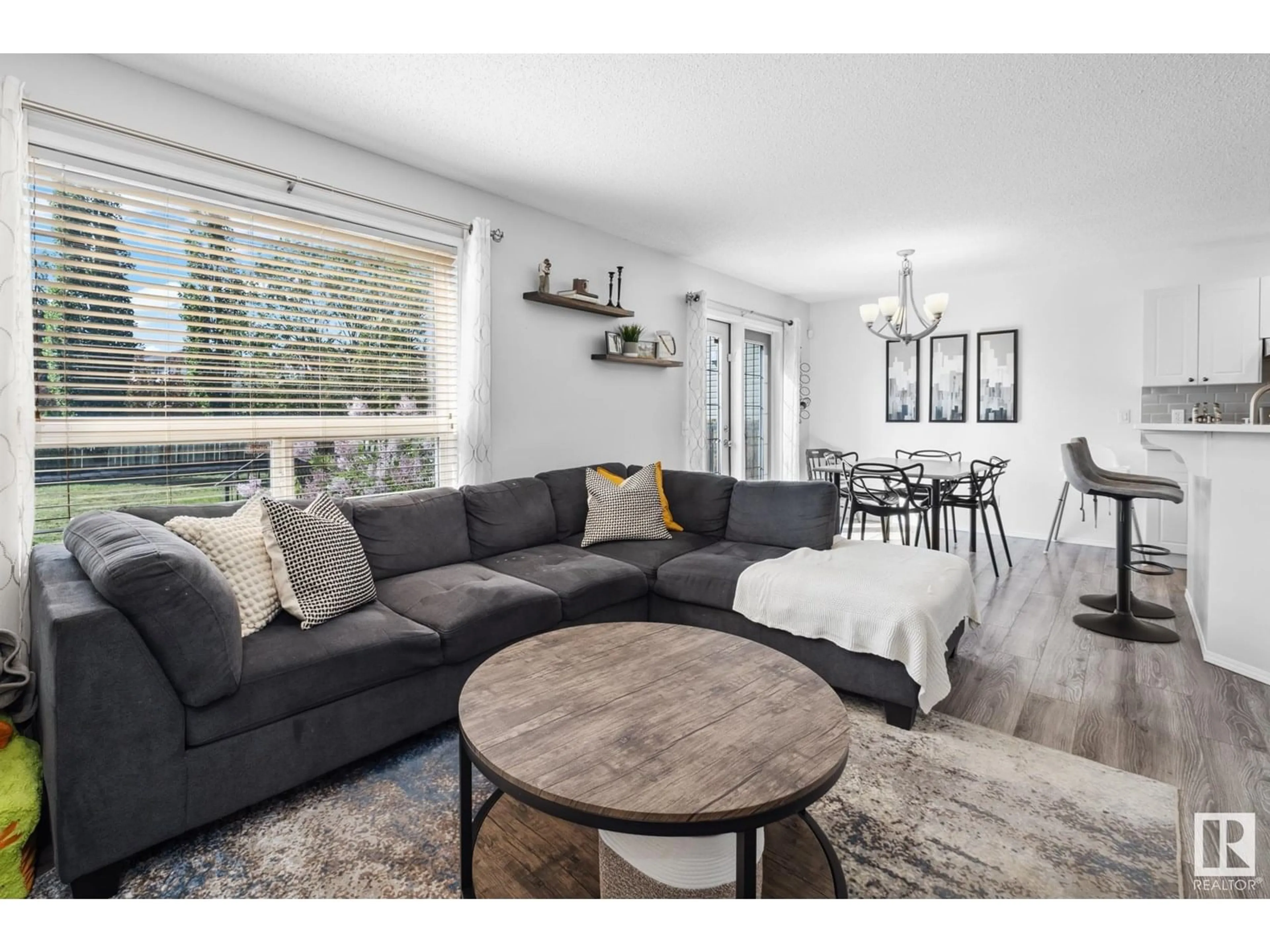 Living room with furniture, wood/laminate floor for NW - 9016 210 ST, Edmonton Alberta T5T6X1