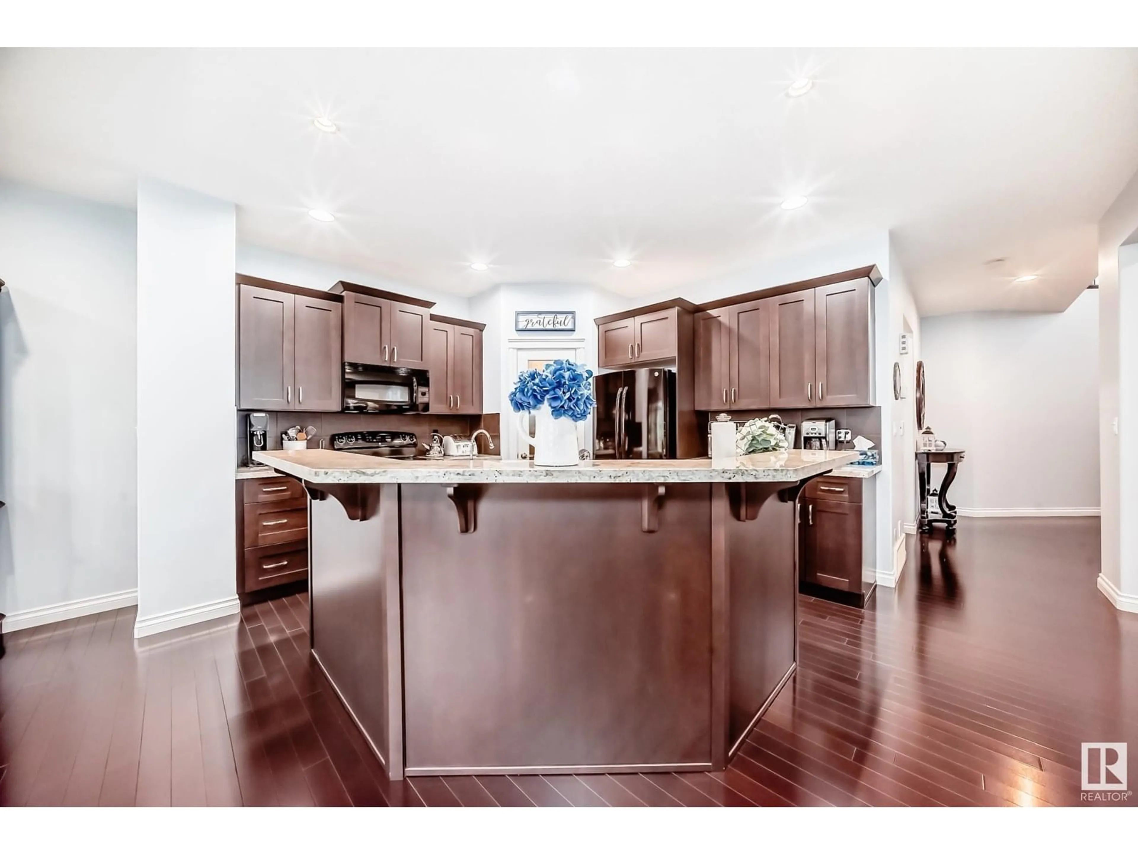 Open concept kitchen, wood/laminate floor for 1141 HAYS DR, Edmonton Alberta T6M0M2
