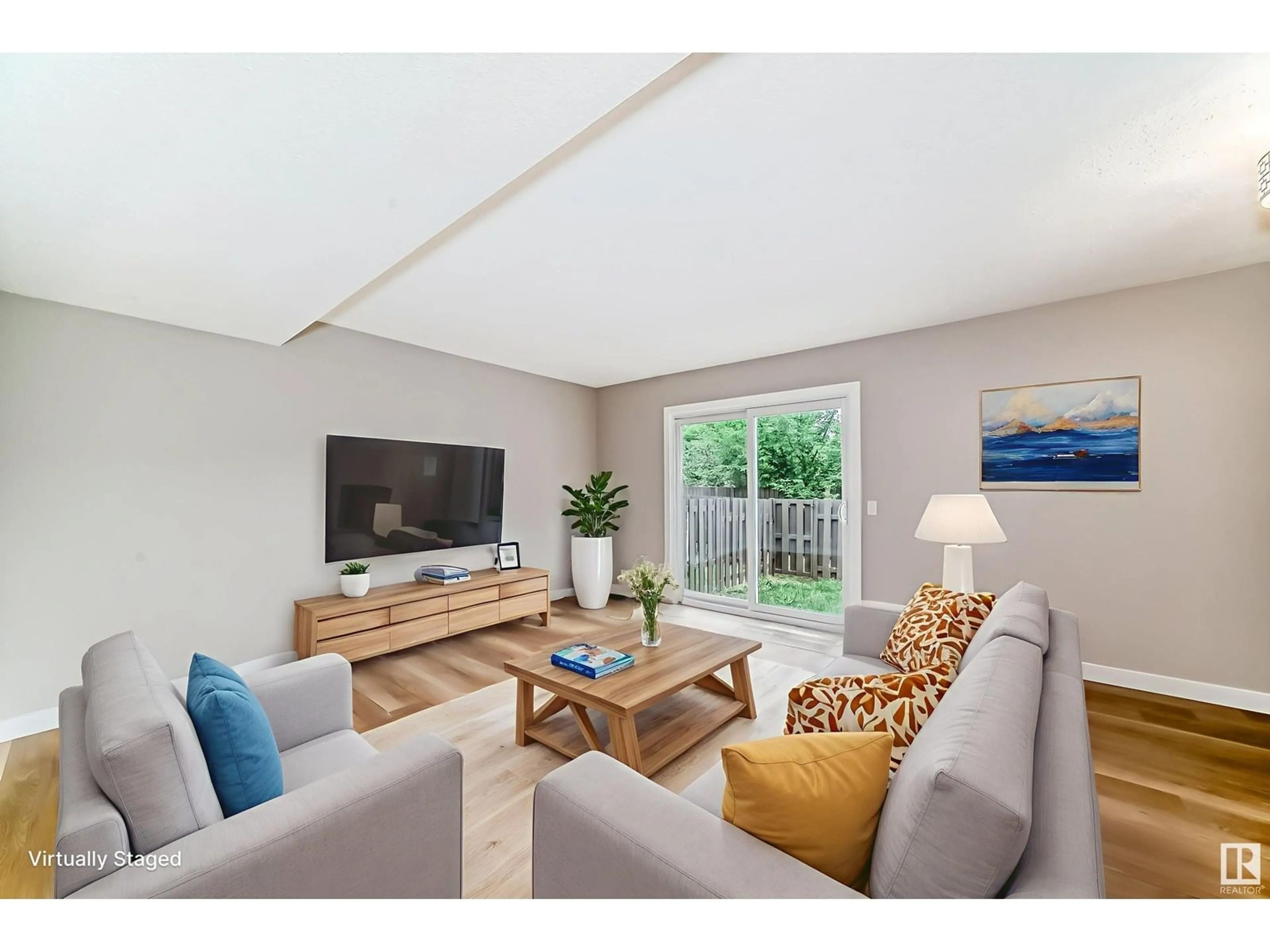 Living room with furniture, wood/laminate floor for 3161 138 AV, Edmonton Alberta T5Y1R1