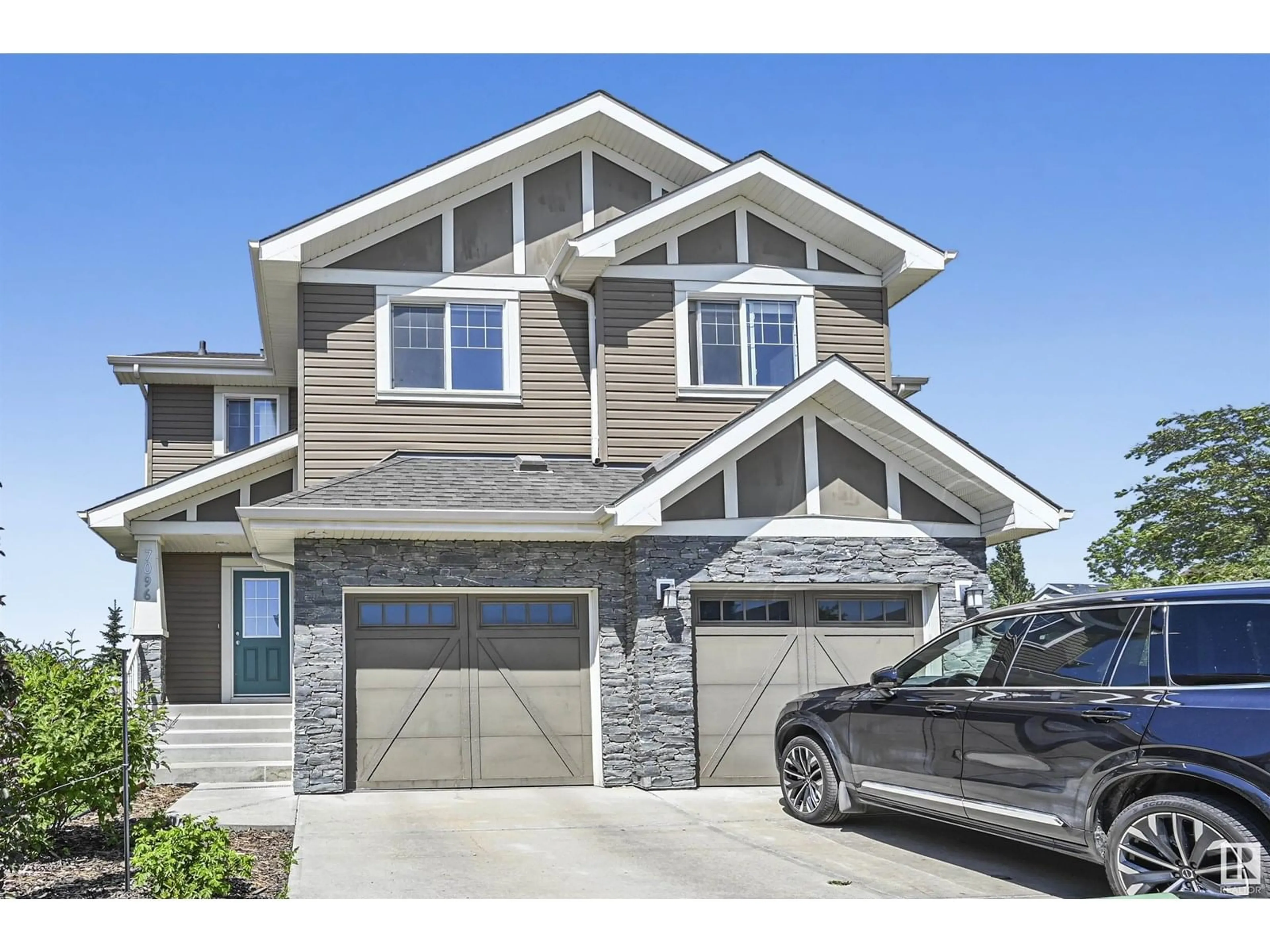 Home with vinyl exterior material, street for 7096 SOUTH TERWILLEGAR DR, Edmonton Alberta T6R0V1