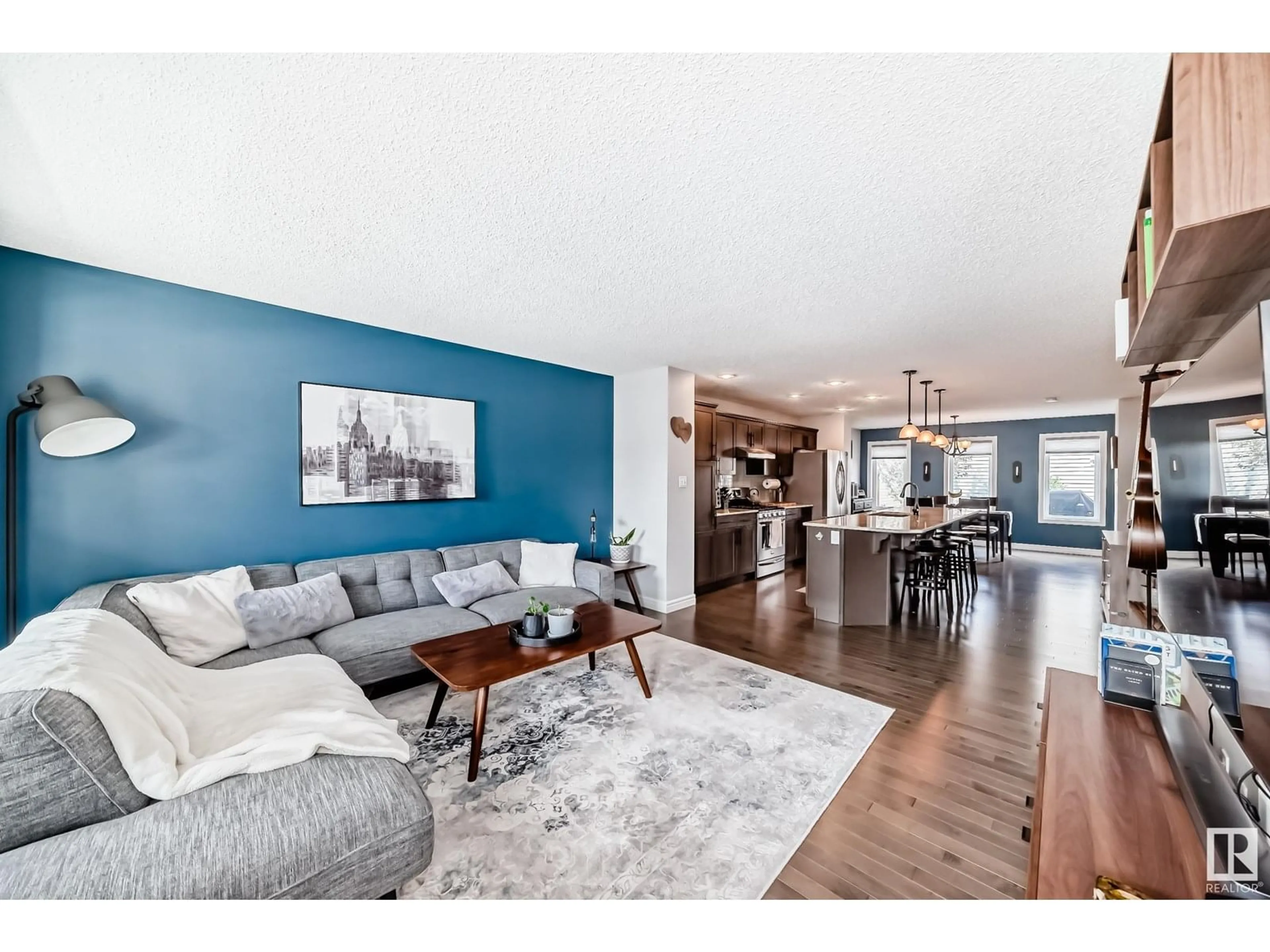 Living room with furniture, wood/laminate floor for 12240 173 AV, Edmonton Alberta T5X0K2