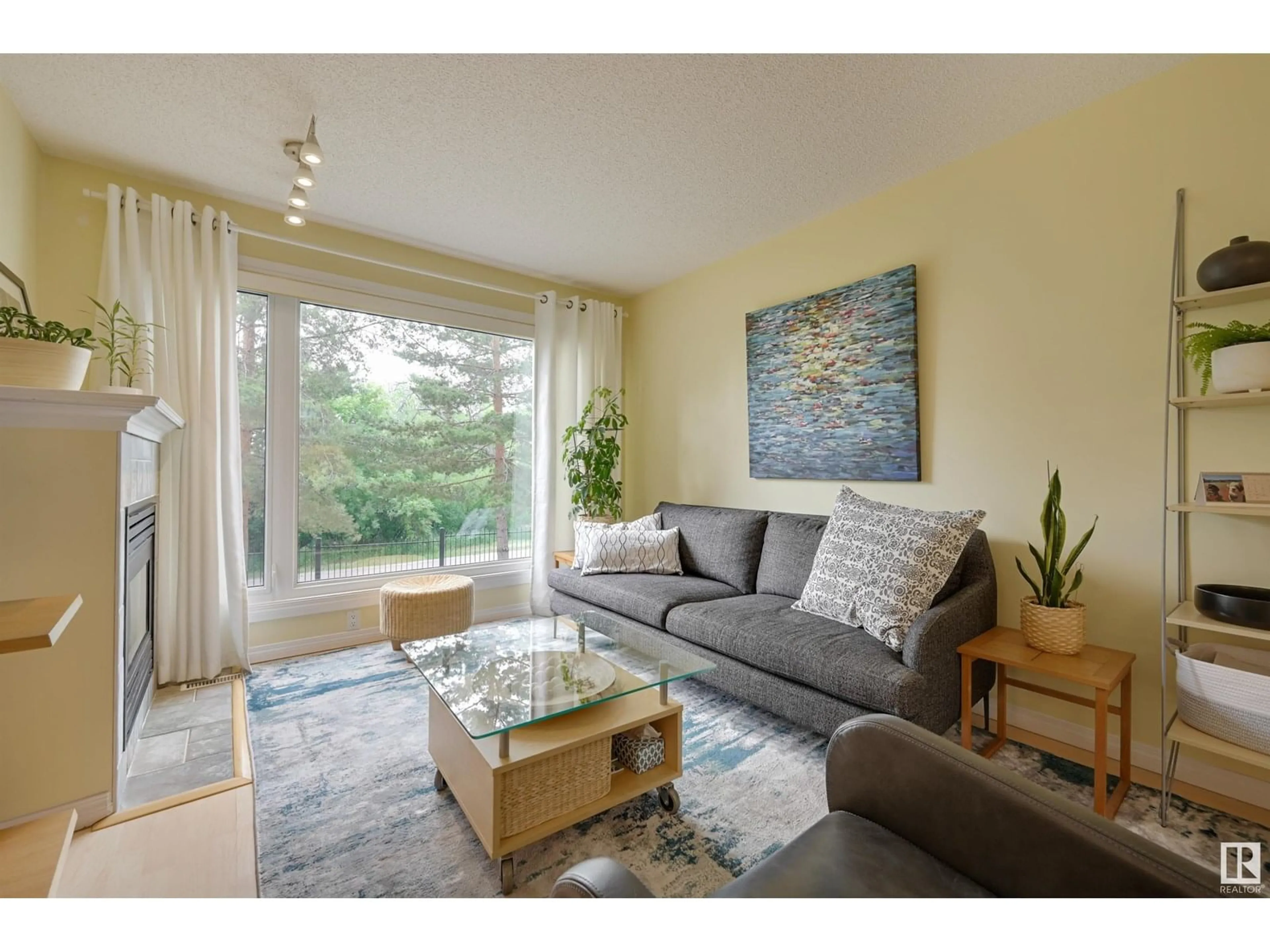 Living room with furniture, wood/laminate floor for #104 - 10105 95 ST, Edmonton Alberta T5H4M4