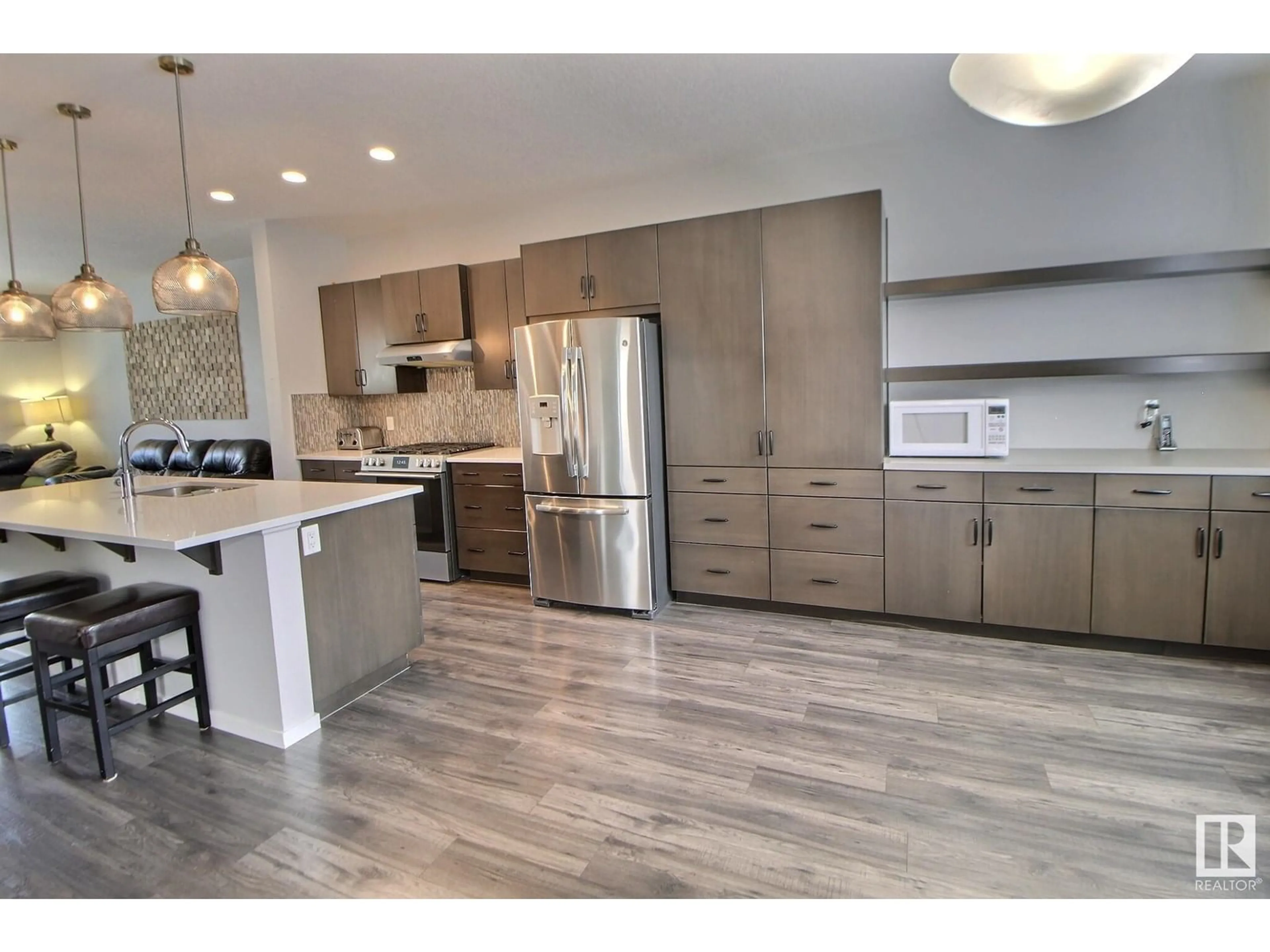 Open concept kitchen, wood/laminate floor for SW - 3456 CUTLER CR, Edmonton Alberta T6W2B3