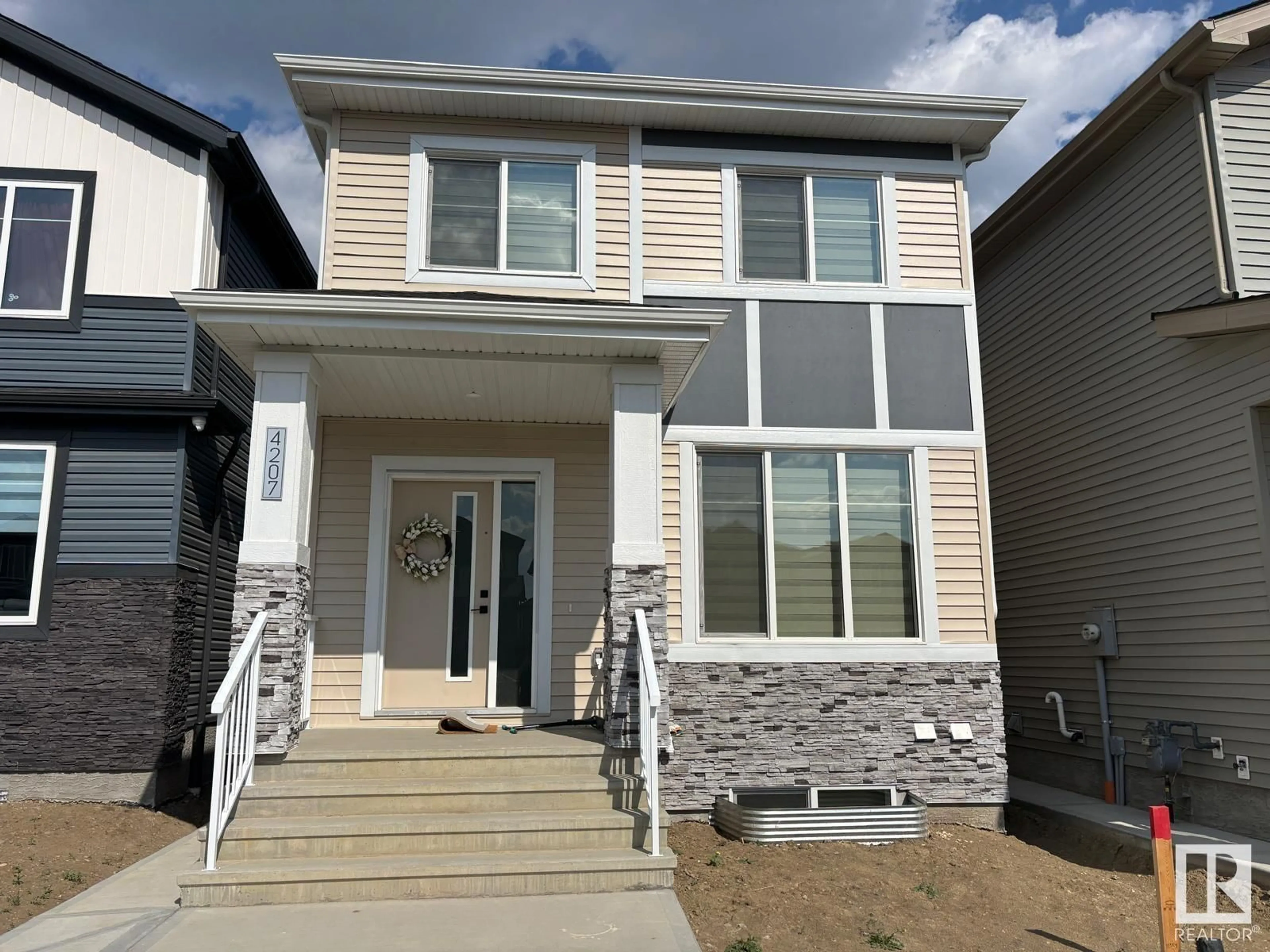 Home with vinyl exterior material, street for 4207 - 4207 38 ST, Beaumont Alberta T4X3B2