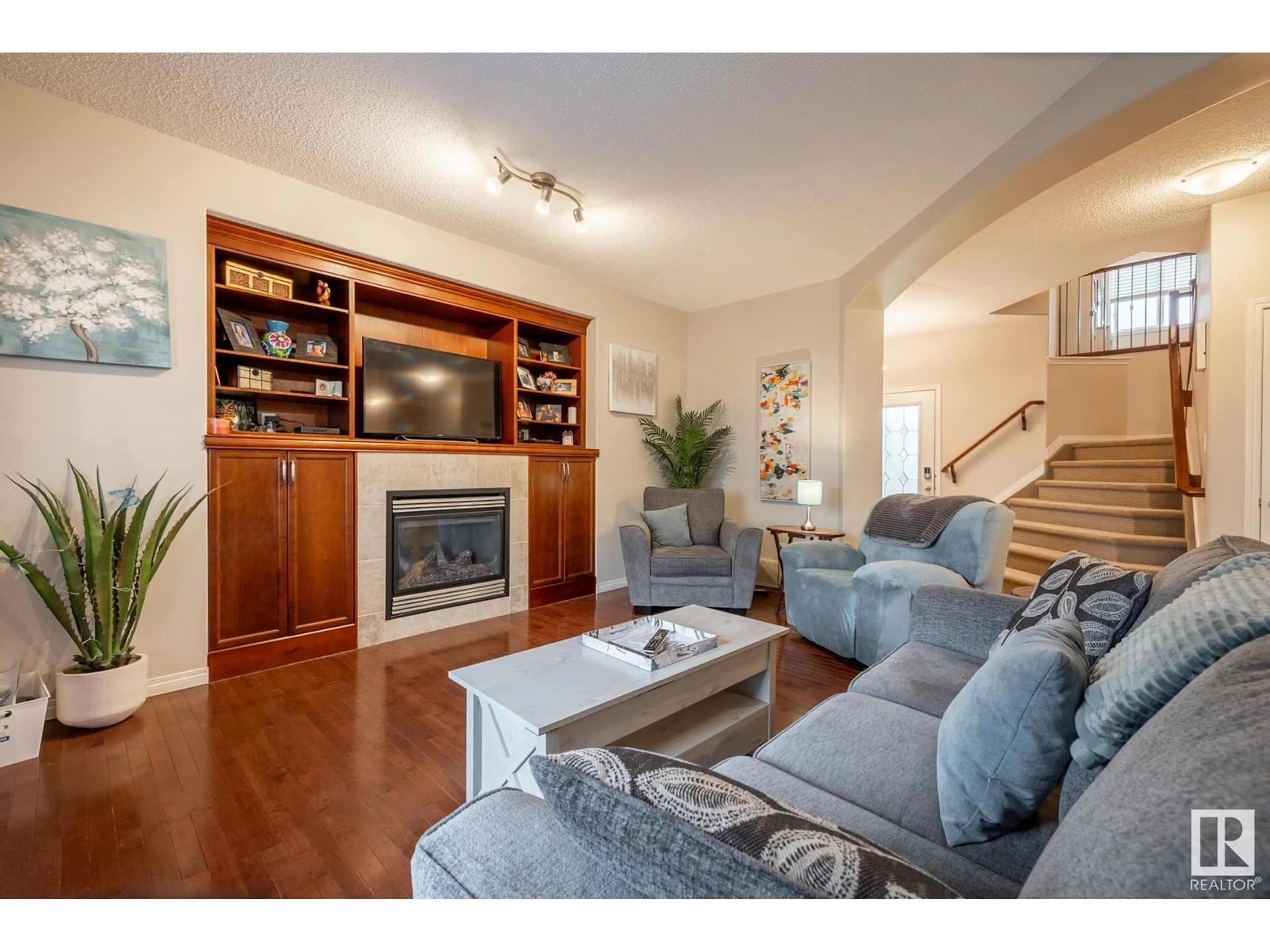 Living room with furniture, wood/laminate floor for 217 FOXTIAL WY, Sherwood Park Alberta T8A3C2