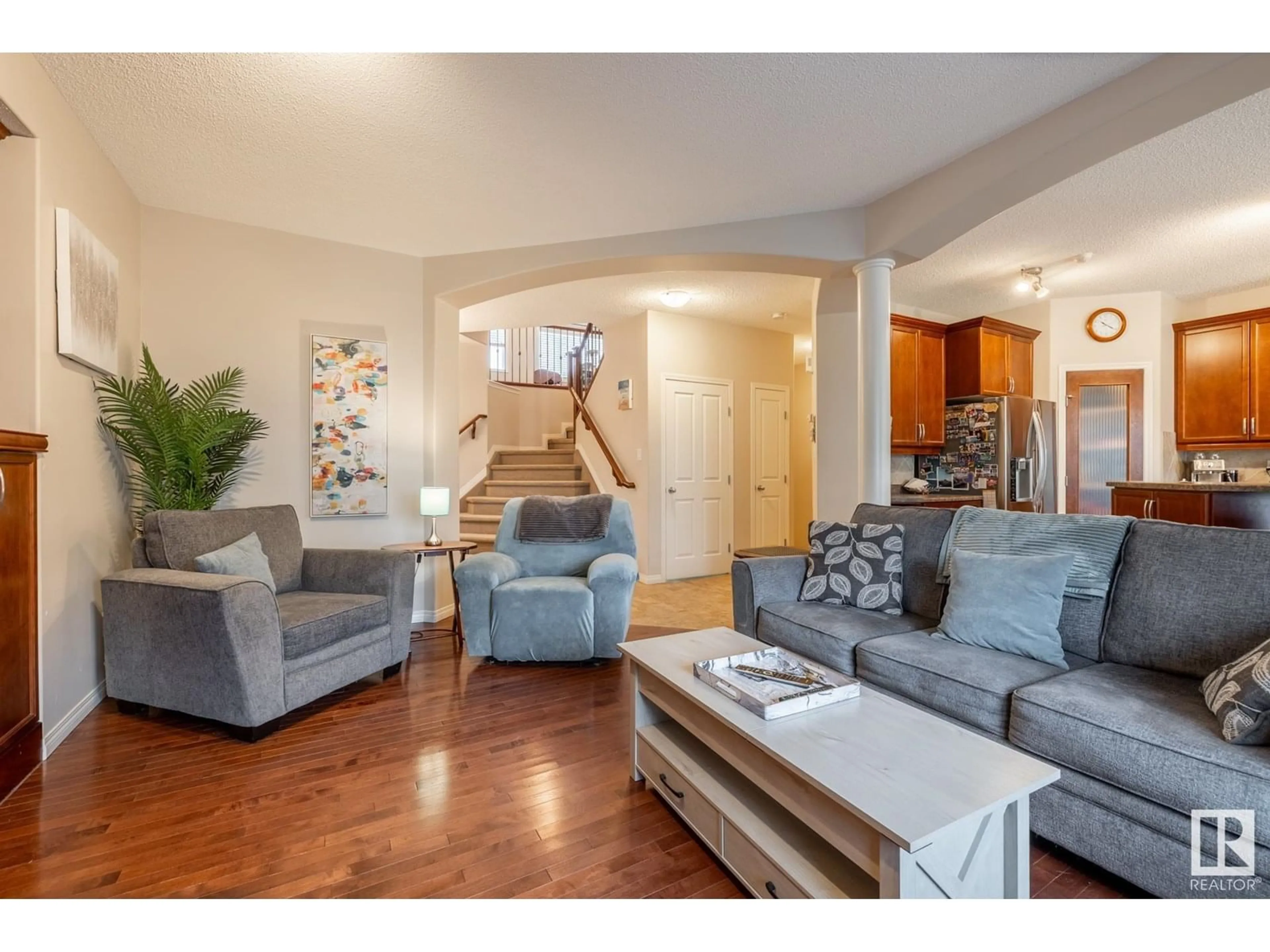Living room with furniture, wood/laminate floor for 217 FOXTIAL WY, Sherwood Park Alberta T8A3C2