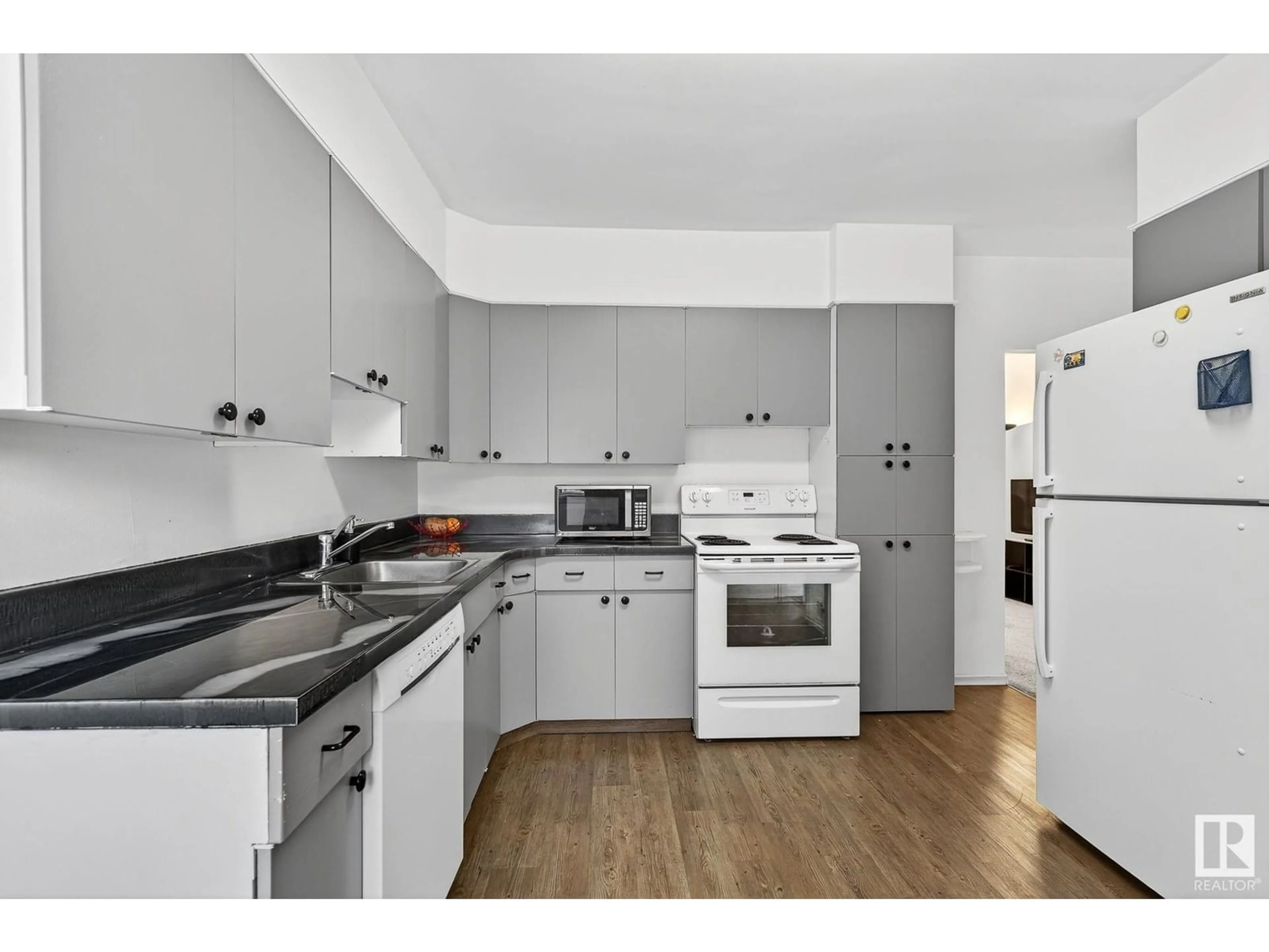 Standard kitchen, wood/laminate floor for NW - 10203 83 ST, Edmonton Alberta T6A3N7