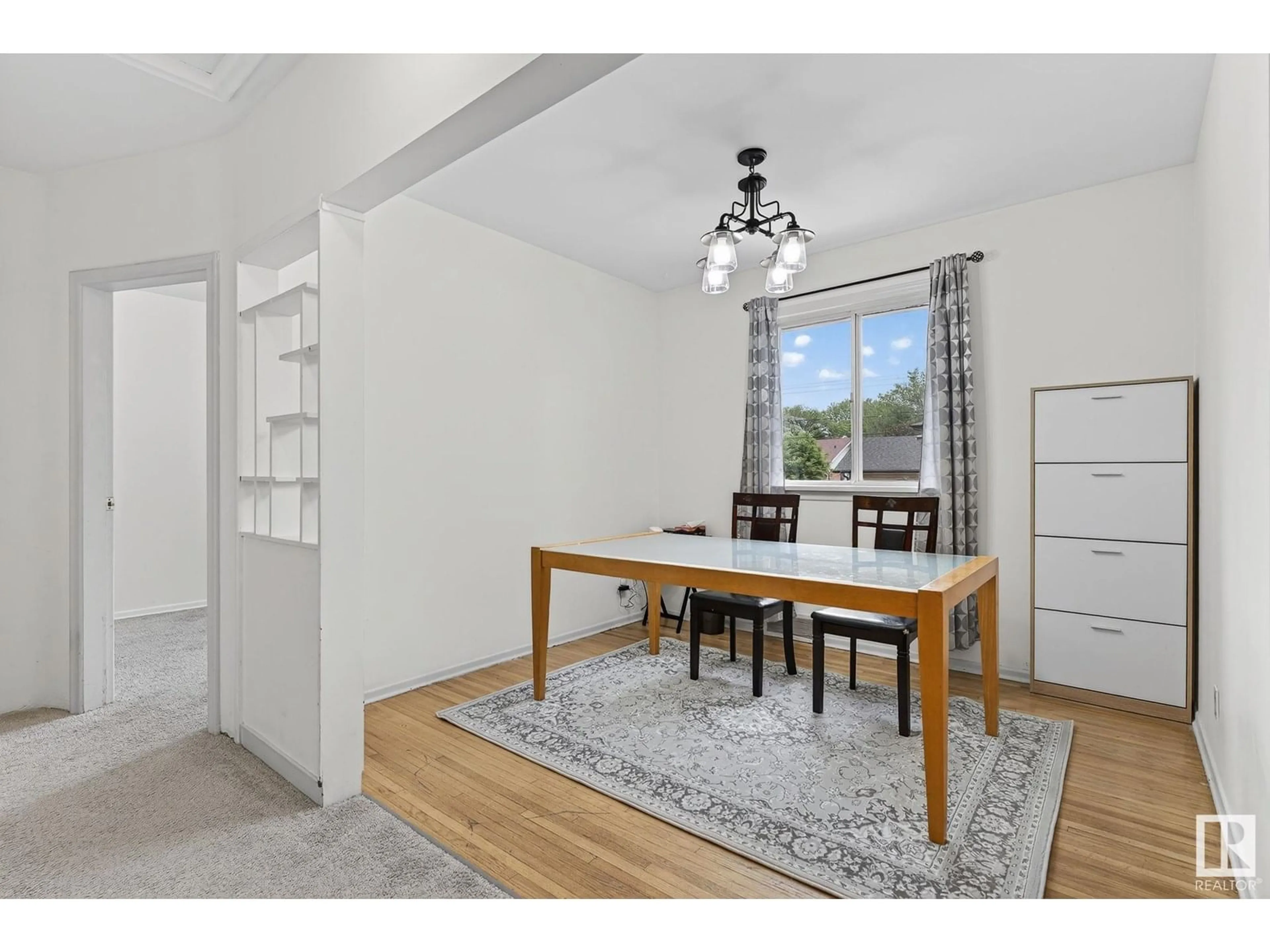 Dining room, wood/laminate floor for NW - 10203 83 ST, Edmonton Alberta T6A3N7
