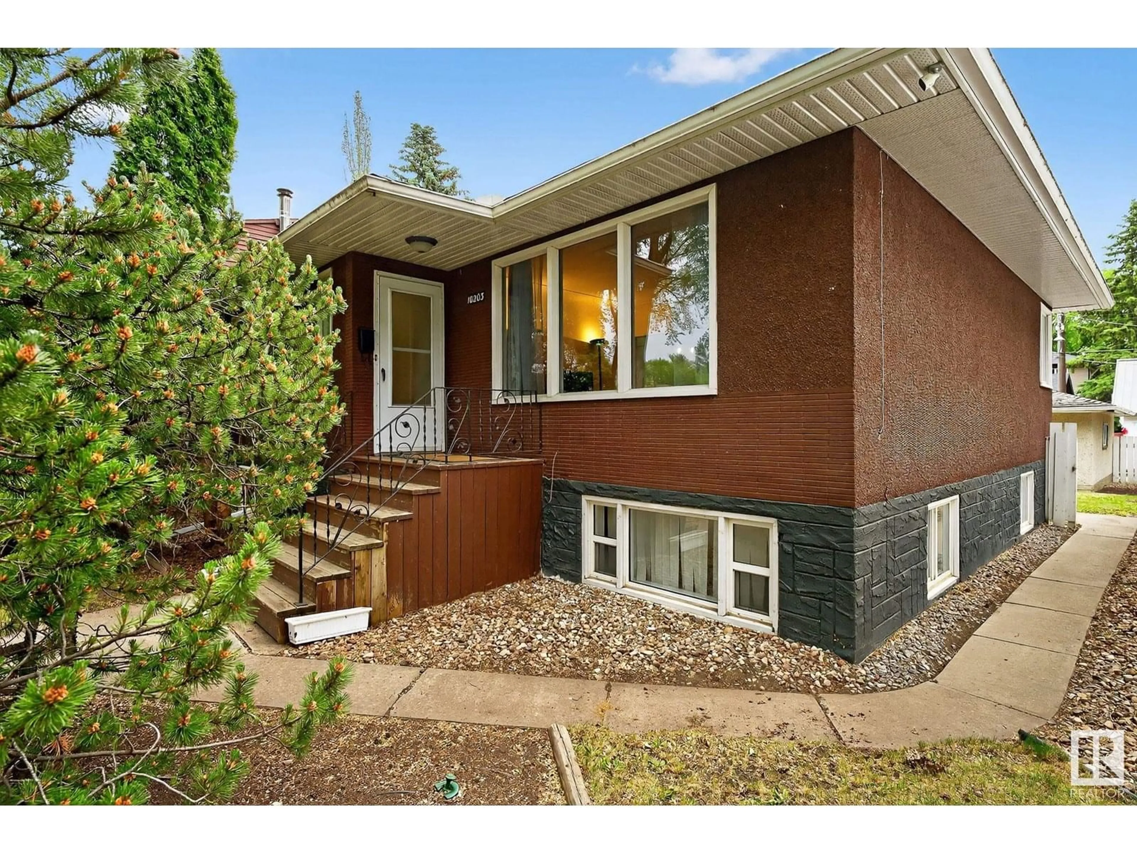 Home with brick exterior material, street for NW - 10203 83 ST, Edmonton Alberta T6A3N7