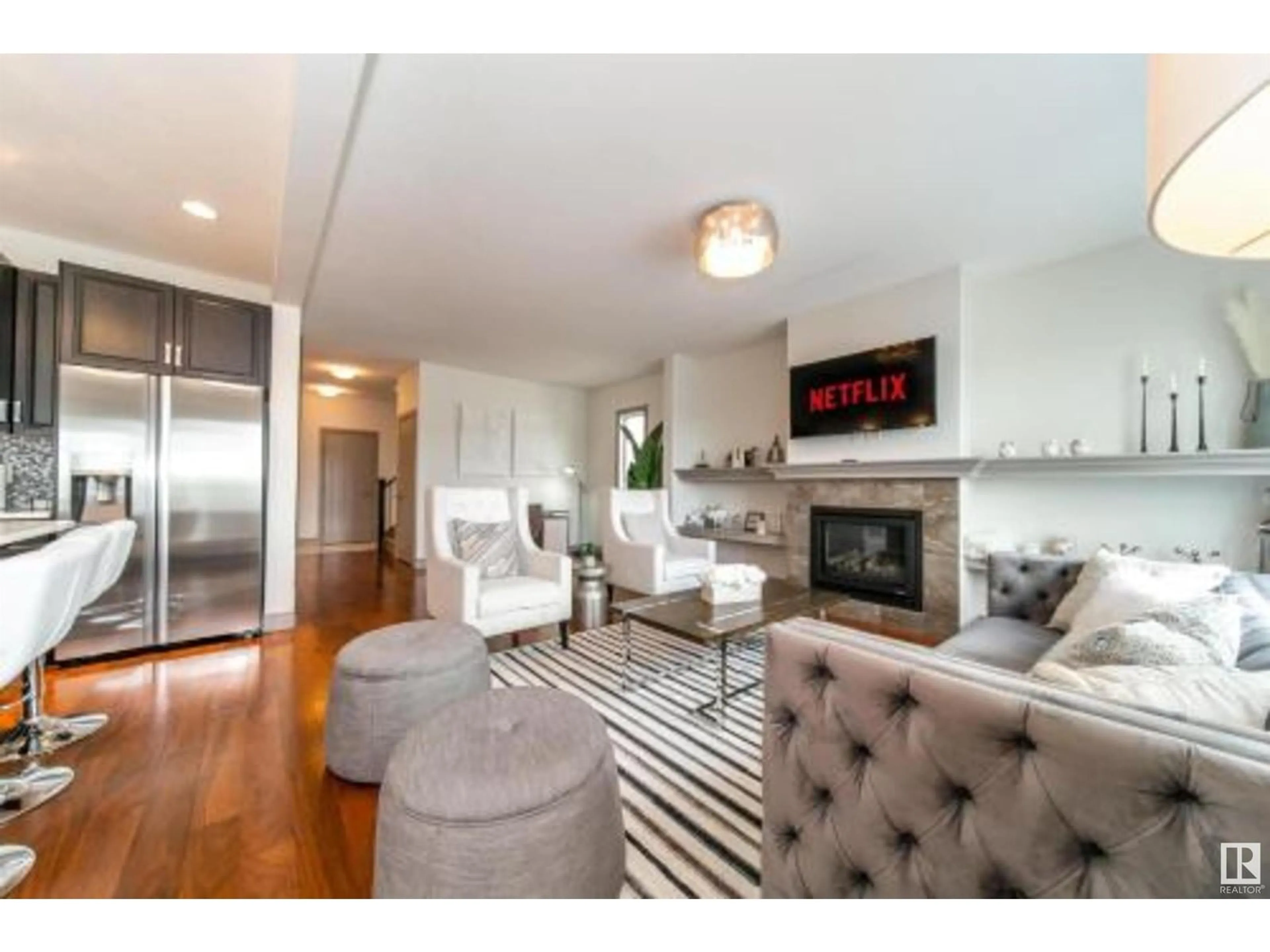 Living room with furniture, wood/laminate floor for SW - 7085 ARMOUR BN, Edmonton Alberta T6W2N9
