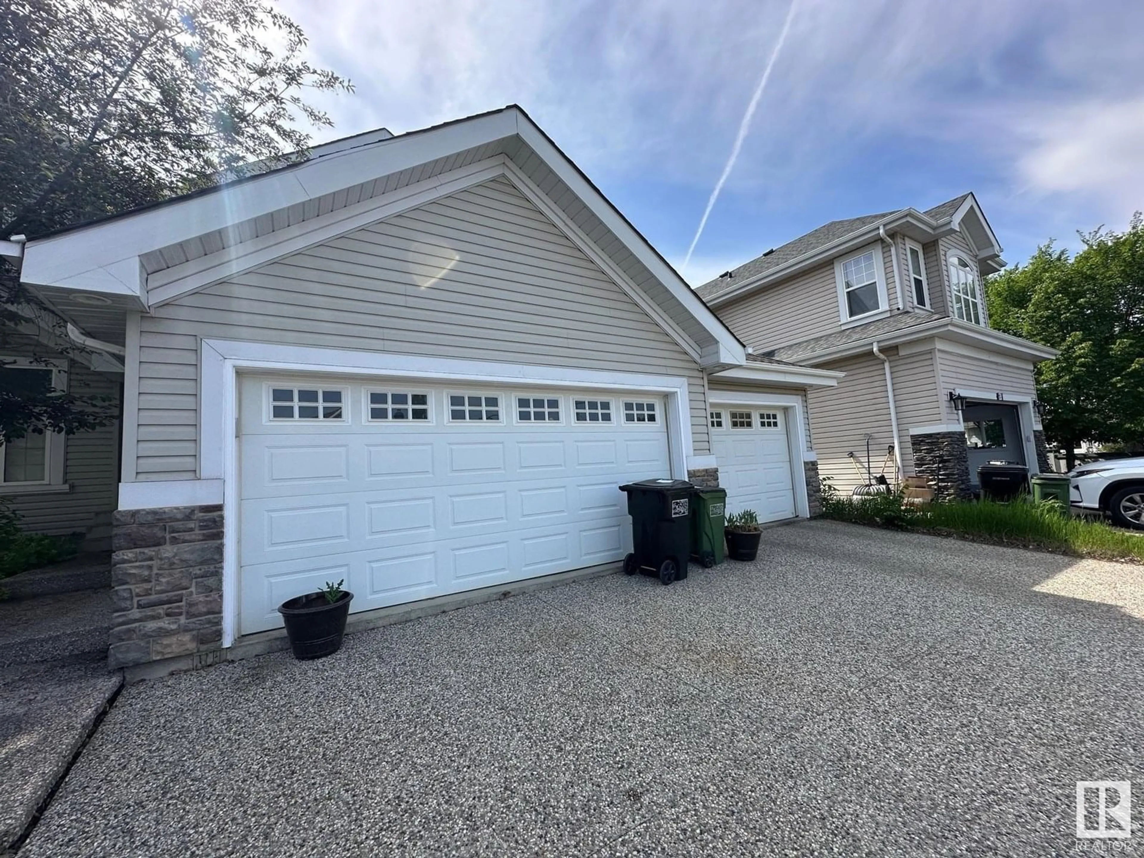 Home with vinyl exterior material, street for 1213 SUMMERSIDE DR, Edmonton Alberta T6X1C5