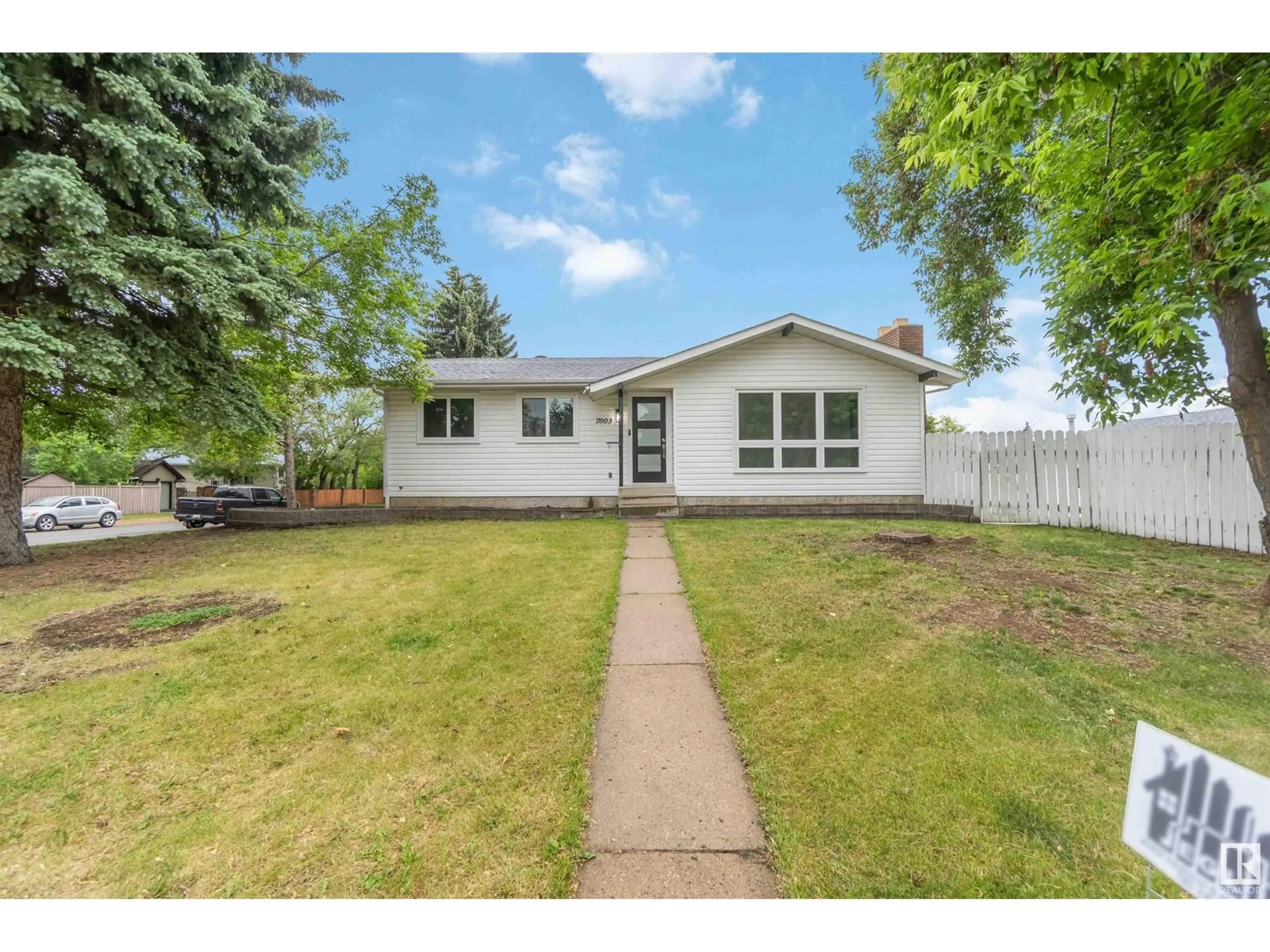 Home with vinyl exterior material, street for 7003 17 AV, Edmonton Alberta T6K2R2