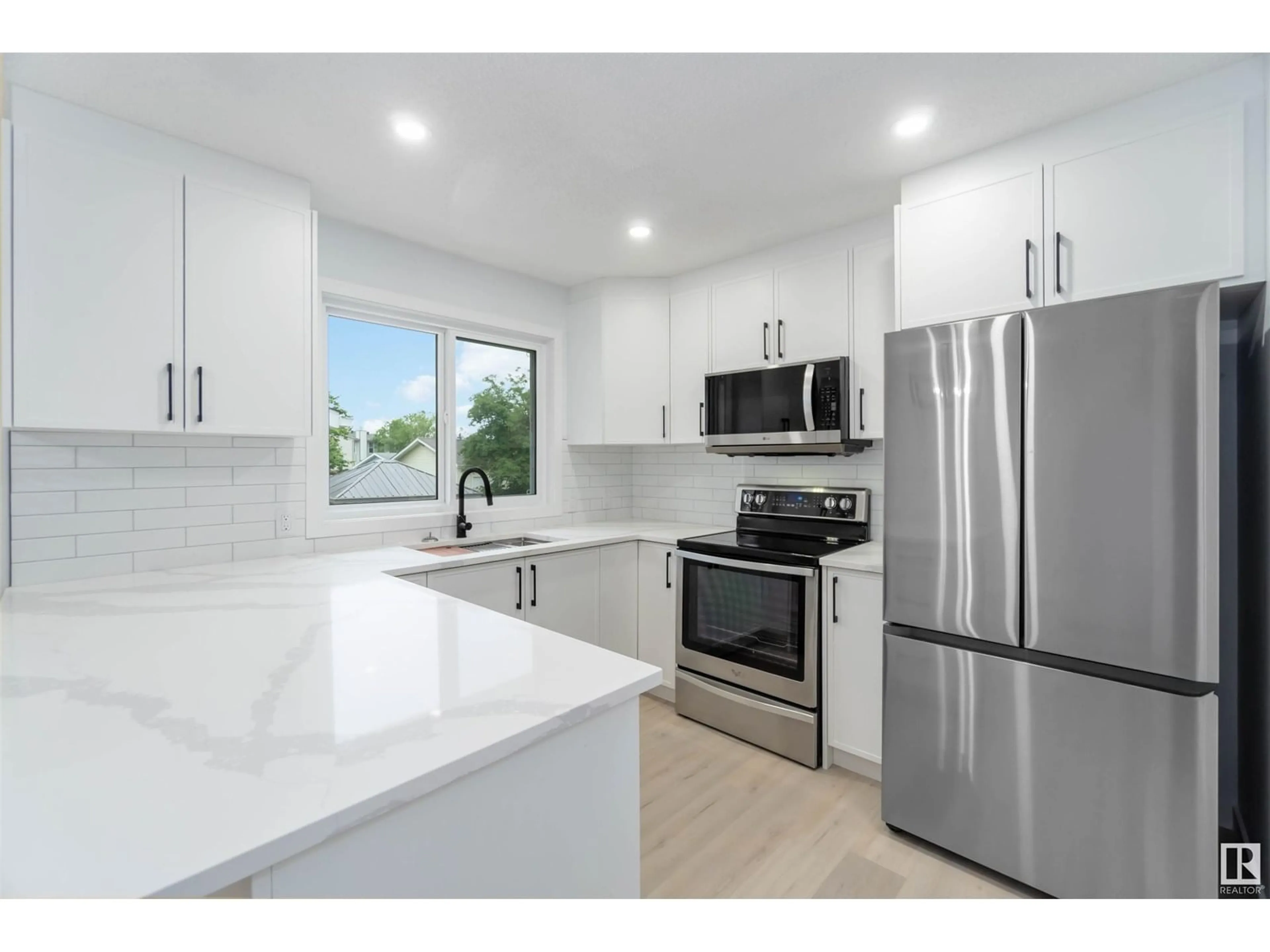 Open concept kitchen, unknown for 7003 17 AV, Edmonton Alberta T6K2R2