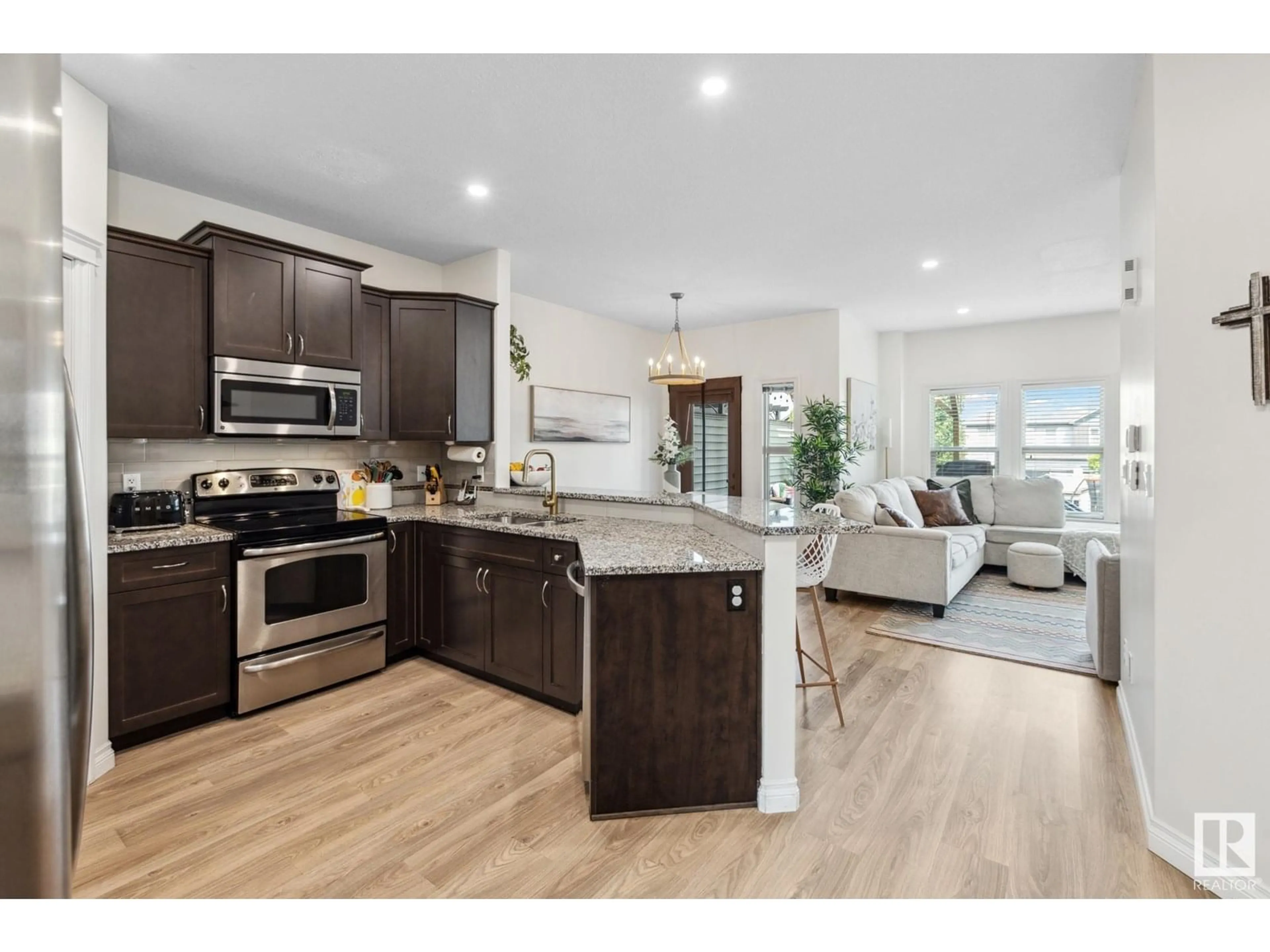 Open concept kitchen, wood/laminate floor for 72 GREENBURY CR, Spruce Grove Alberta T7X0L9