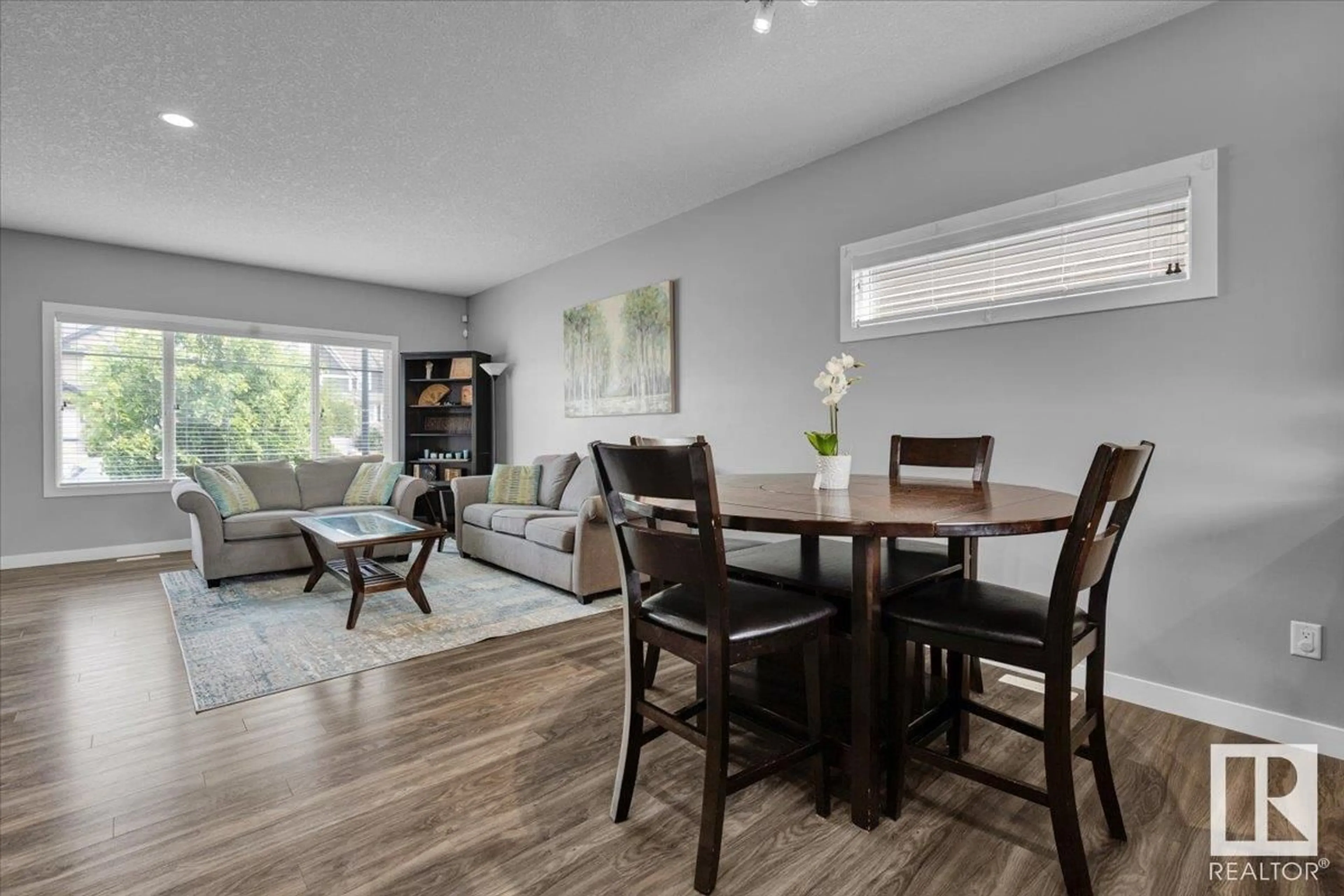 Living room with furniture, wood/laminate floor for PM SW - 1060 WATT PROMENADE, Edmonton Alberta T6X1T7