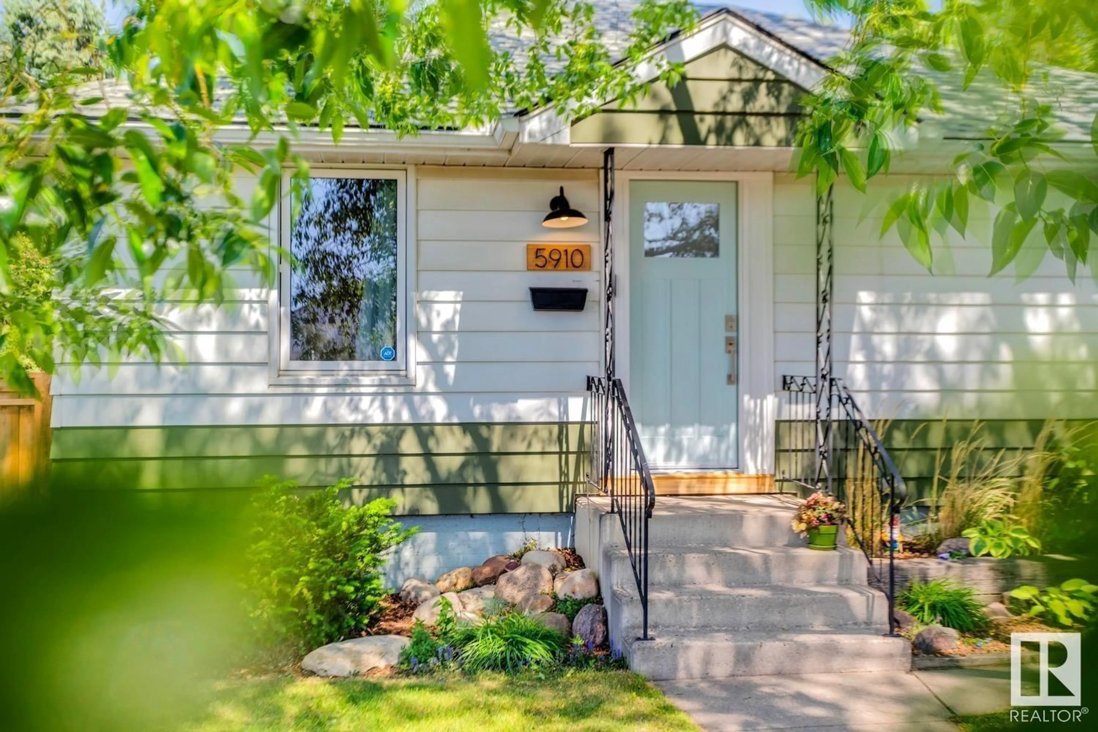 Home with vinyl exterior material, street for NW - 5910 120 AV, Edmonton Alberta T5W1L6