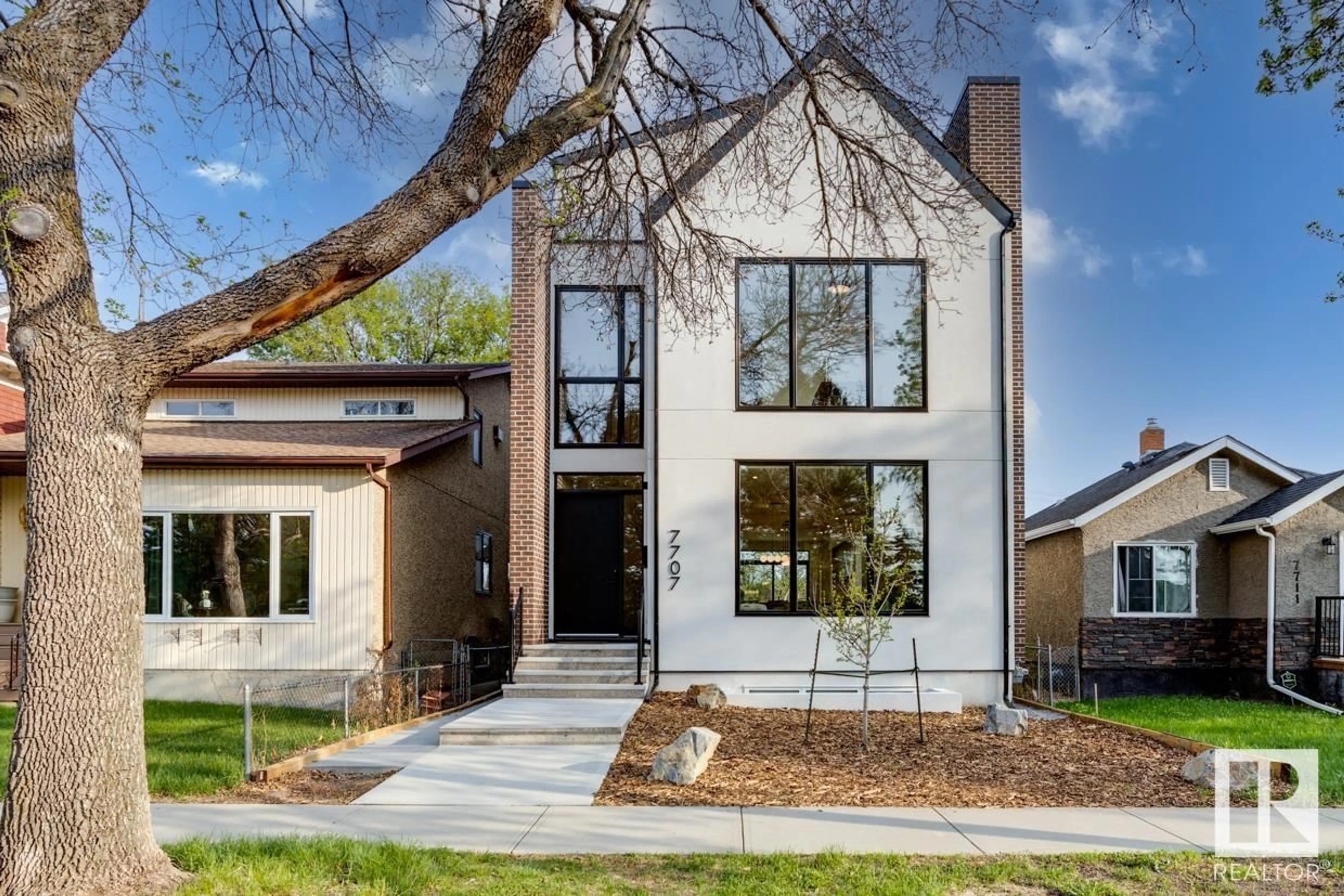 Home with brick exterior material, street for NW - 7707 112S AV, Edmonton Alberta T5B0H5