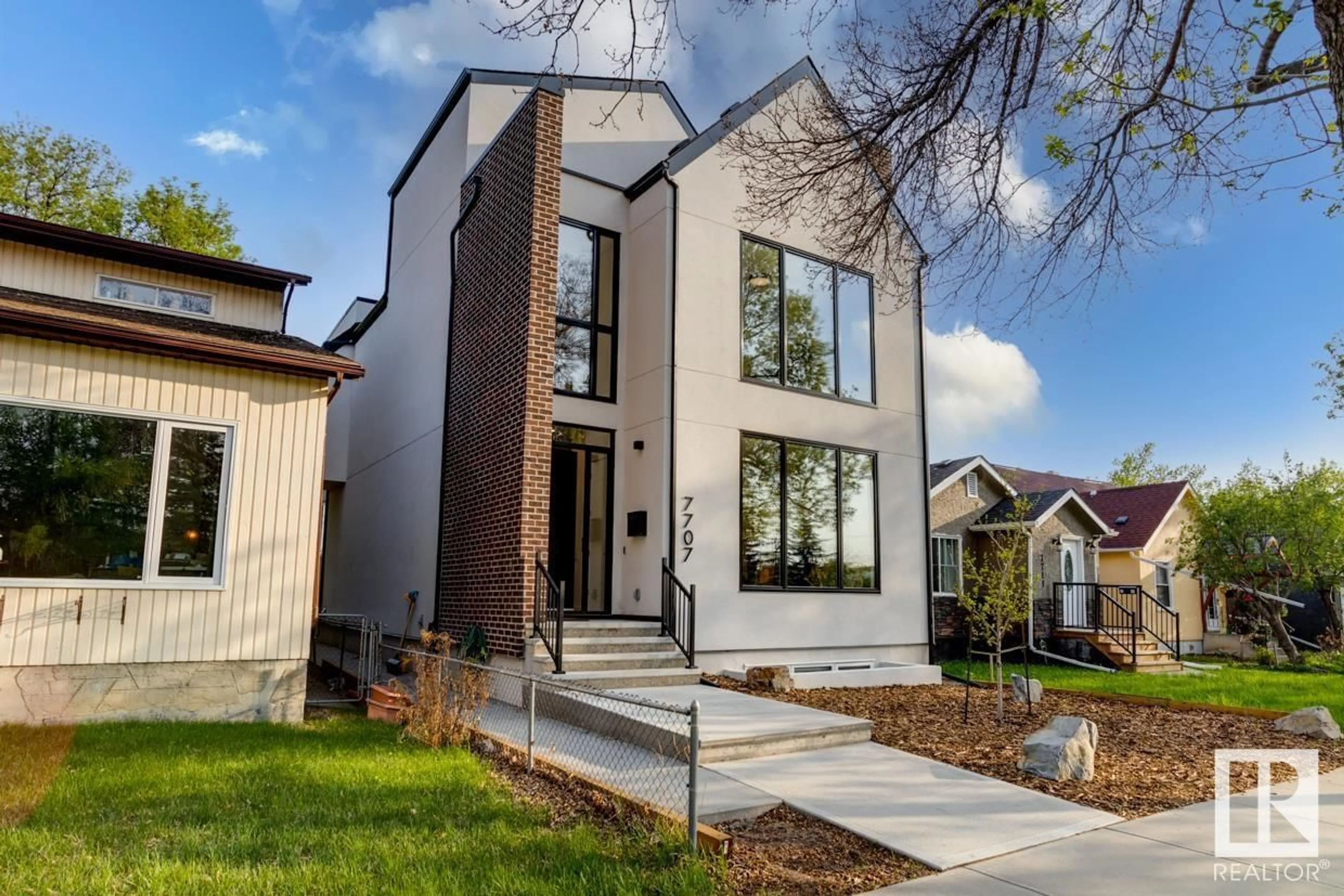 Home with brick exterior material, street for NW - 7707 112S AV, Edmonton Alberta T5B0H5