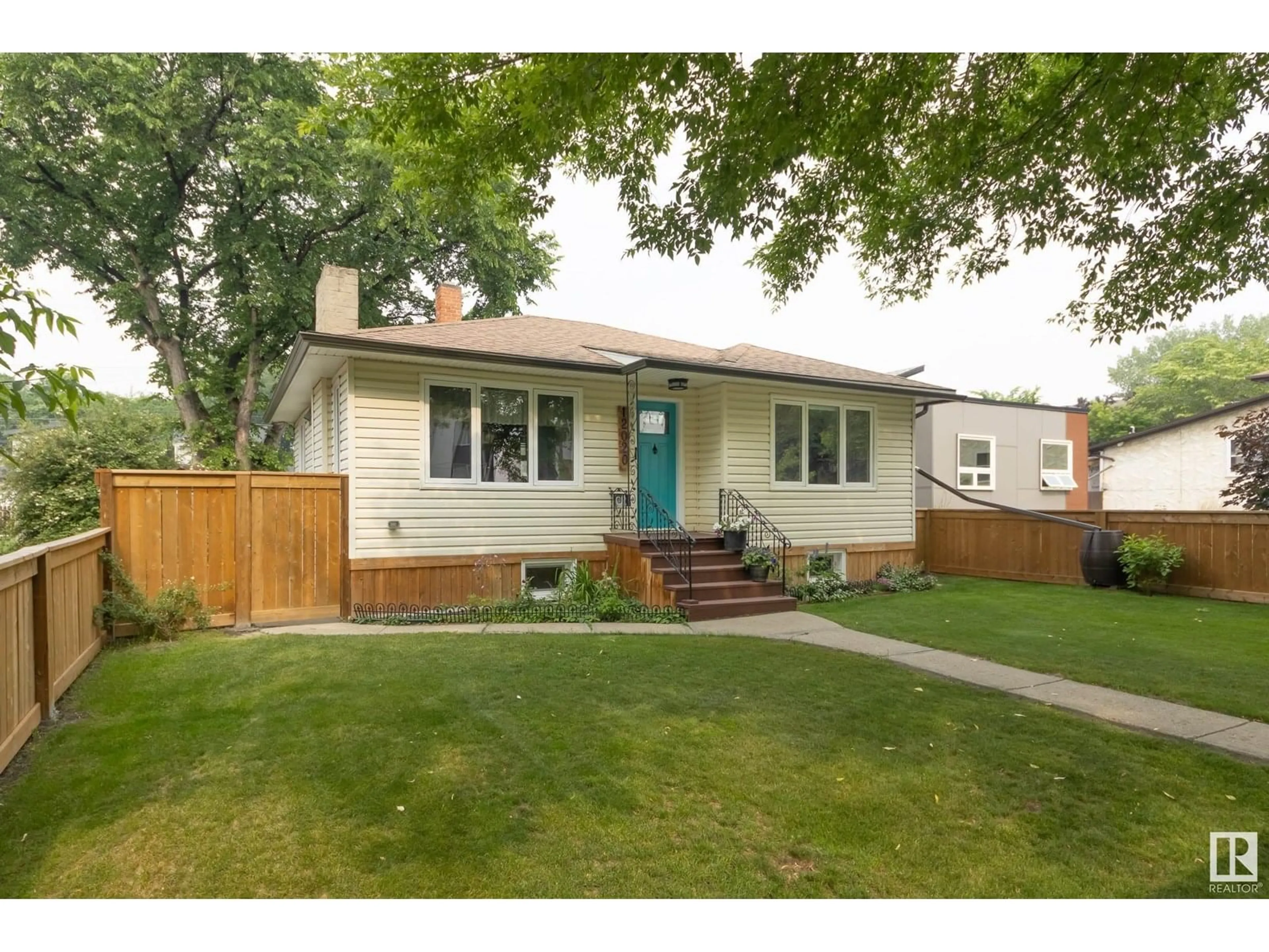 Home with vinyl exterior material, street for NW - 12020 90 ST, Edmonton Alberta T5B3Z1