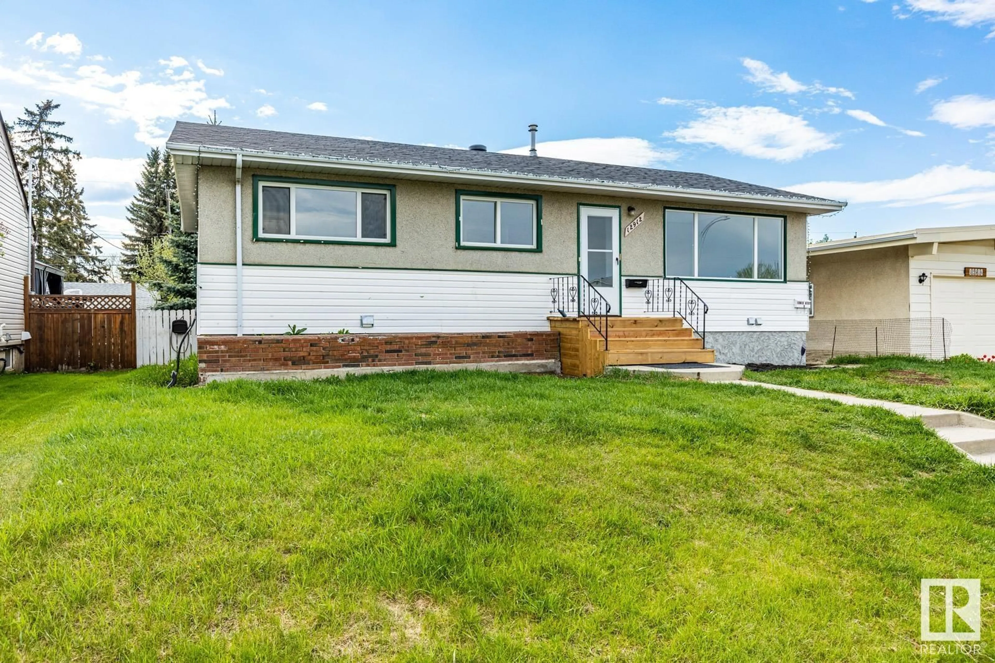Home with vinyl exterior material, street for NW - 12912 87 ST, Edmonton Alberta T5E3E1